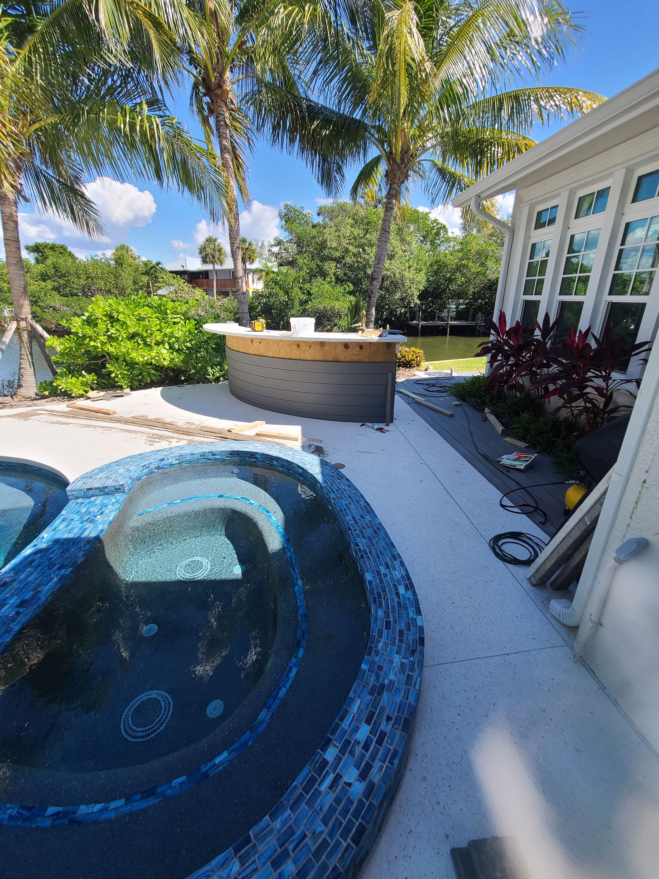 Poolside entertaining area and curved bar — Project 03.
