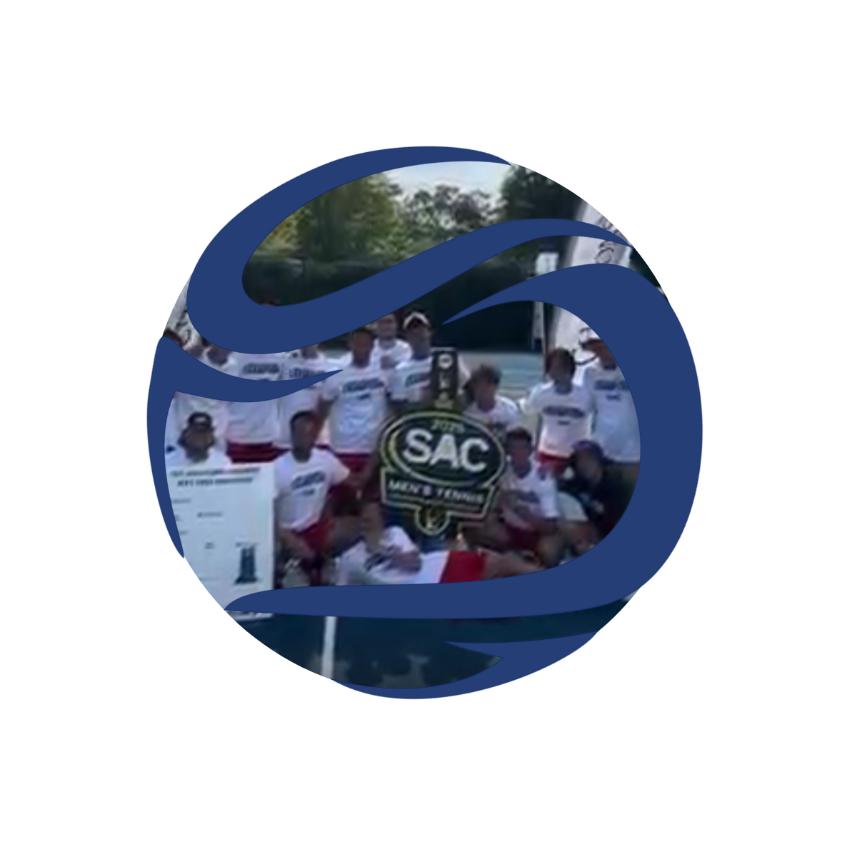 A group of male athletes in white shirts and red shorts posing with a championship trophy and a SAC Men Tennis logo, with a truck and trees in the background.