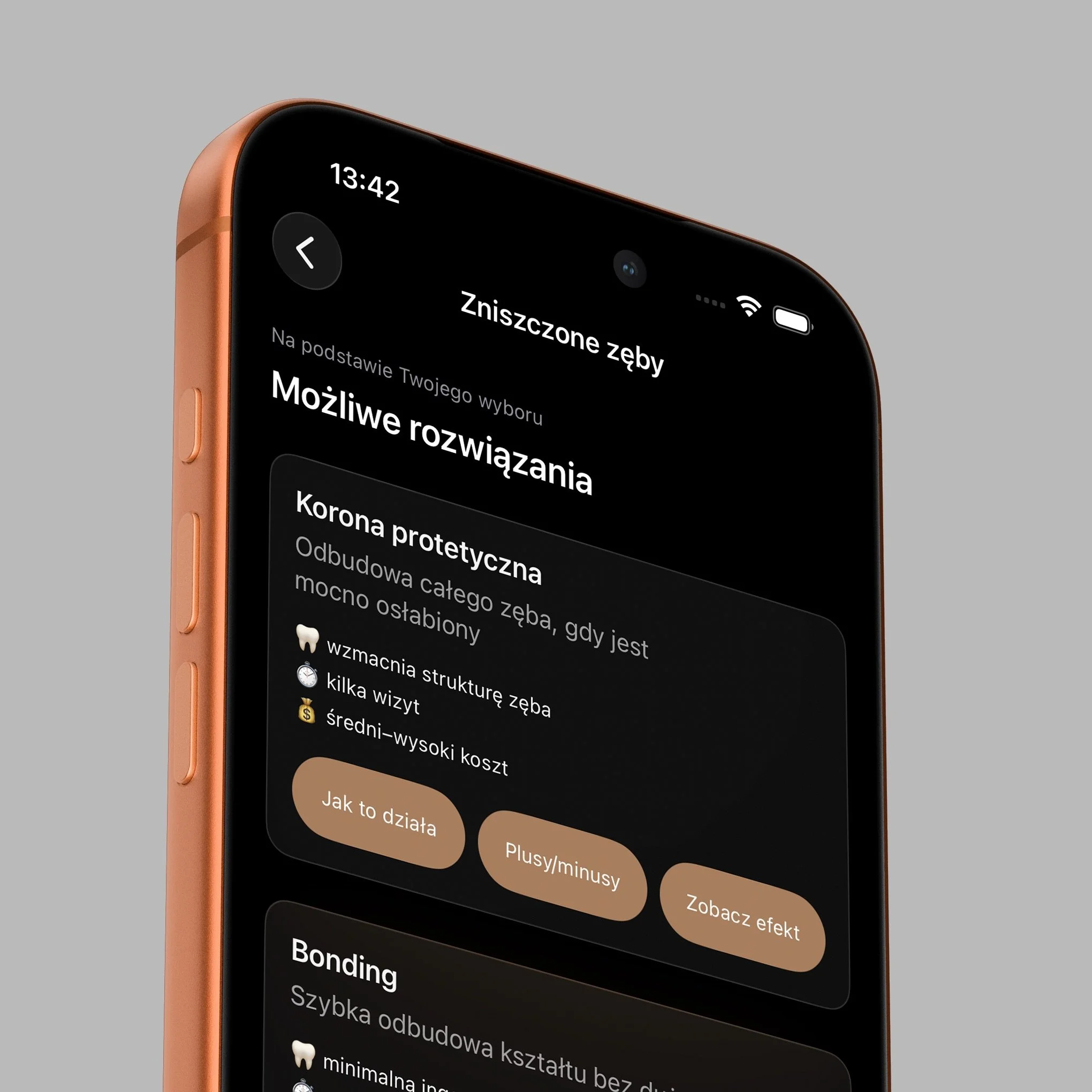 Close-up of a smartphone screen showing text in Polish, with a black background and rose gold edges of the phone visible, set against a light grey background.