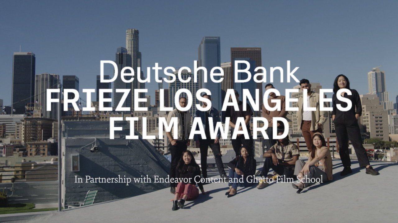 Group of diverse young people on rooftop with Los Angeles city skyline in background, promoting Deutsche Bank Frieze Los Angeles Film Award.