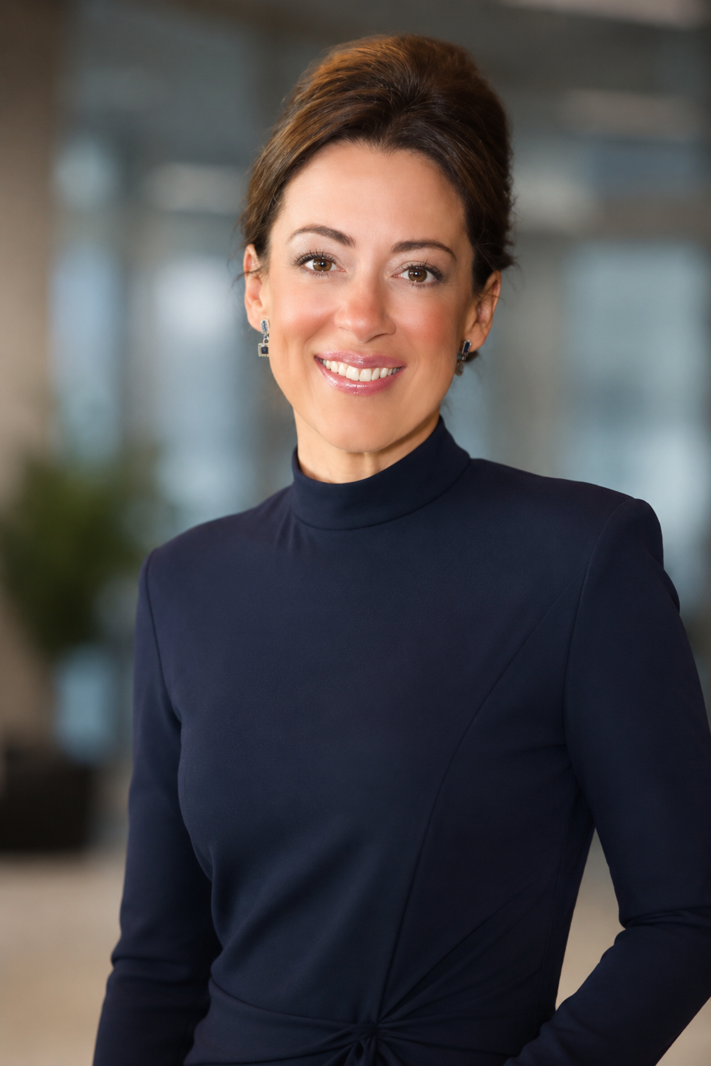 Nicole Huntley, founder and CEO of Westbrook. Woman with brown hair in updo and a navy blue shirt
