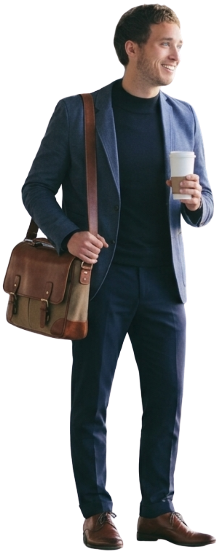 A young man with dark curly hair, smiling, wearing a dark turtleneck, blue blazer, and dark pants. He carries a brown leather shoulder bag and holds a disposable coffee cup.