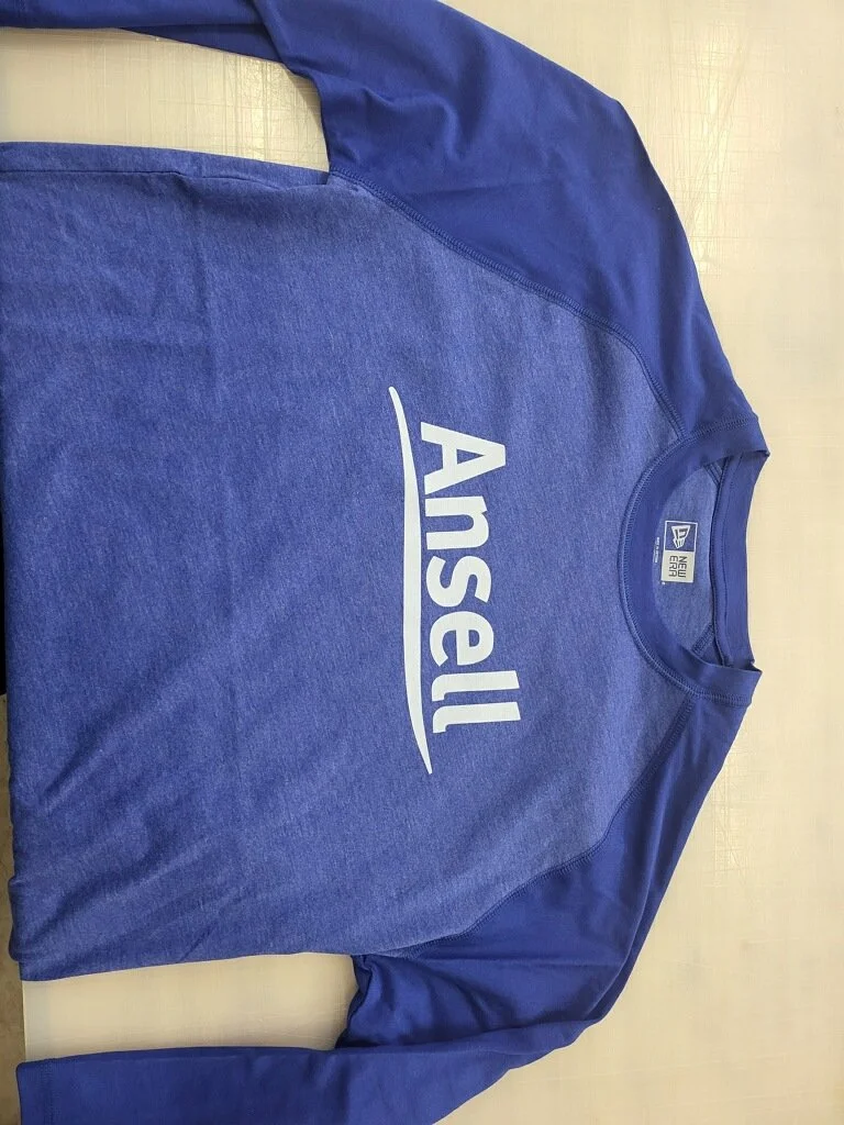Blue athletic sweatshirt with the Ansel logo and brand tag on the inside neckline.