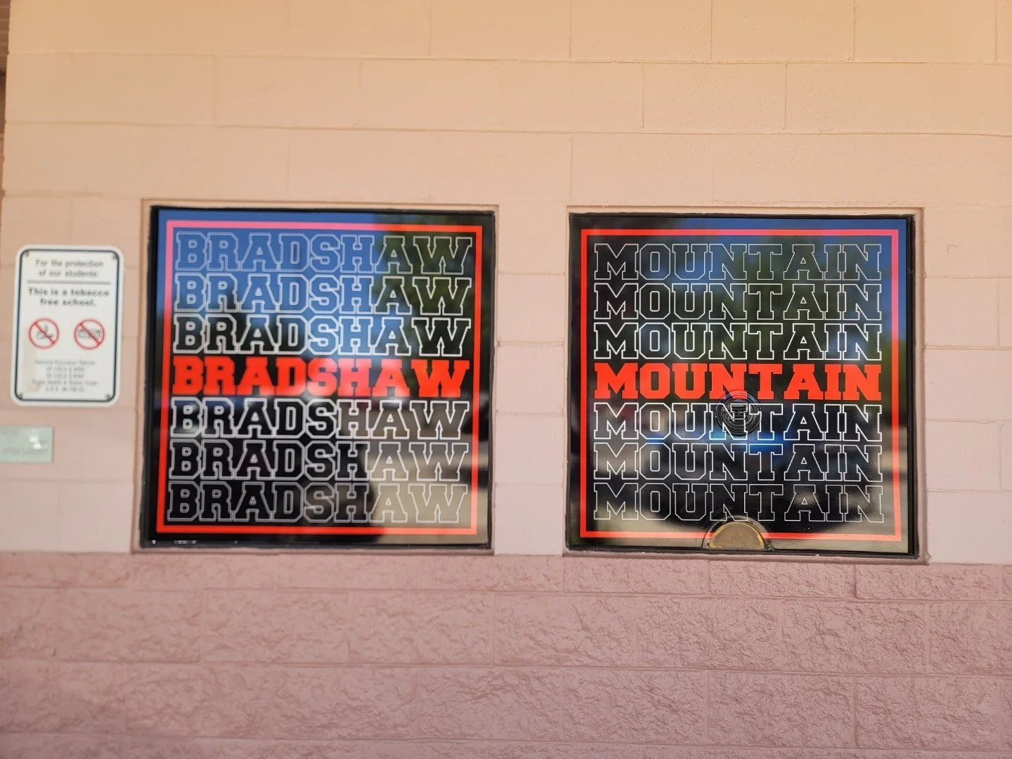 Two posters with the words 'Bradshaw' and 'Mountain' in bold, colorful text. The 'Bradshaw' poster has the word repeated multiple times in black, white, and blue, with one instance in red. The 'Mountain' poster has the word repeated in black, white, 