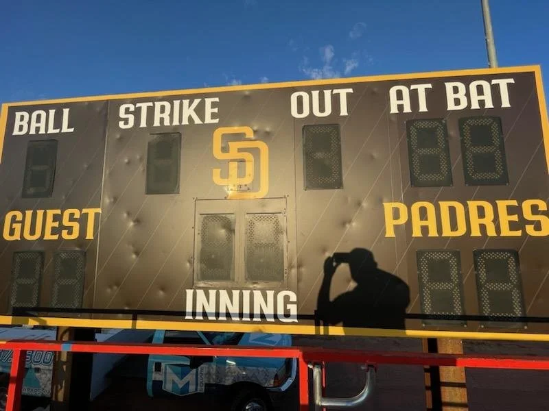 Scoreboard with the San Diego Padres logo, displaying zero runs for each team and no outs or balls counted.