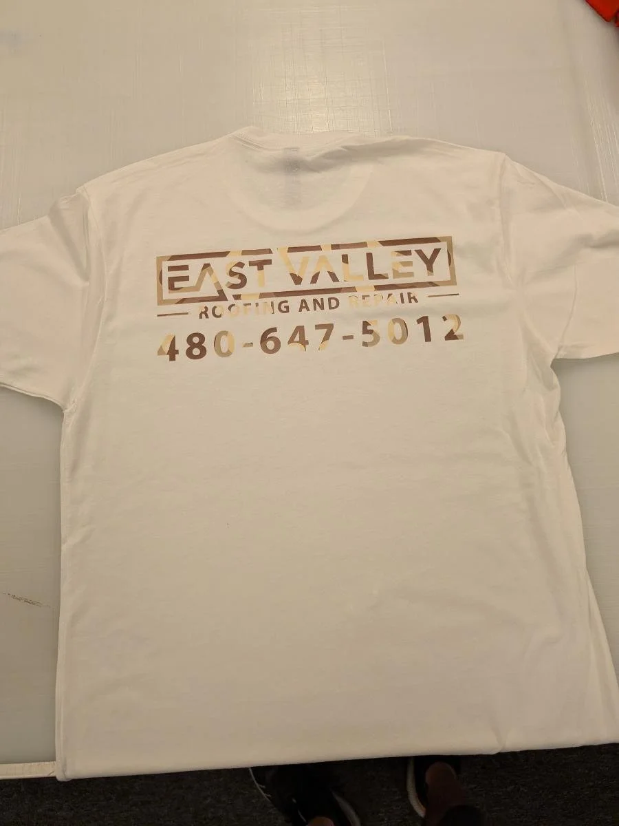 White T-shirt with printed text that reads 'EAST VALLEY Roofing and Siding, 480-647-5012'.