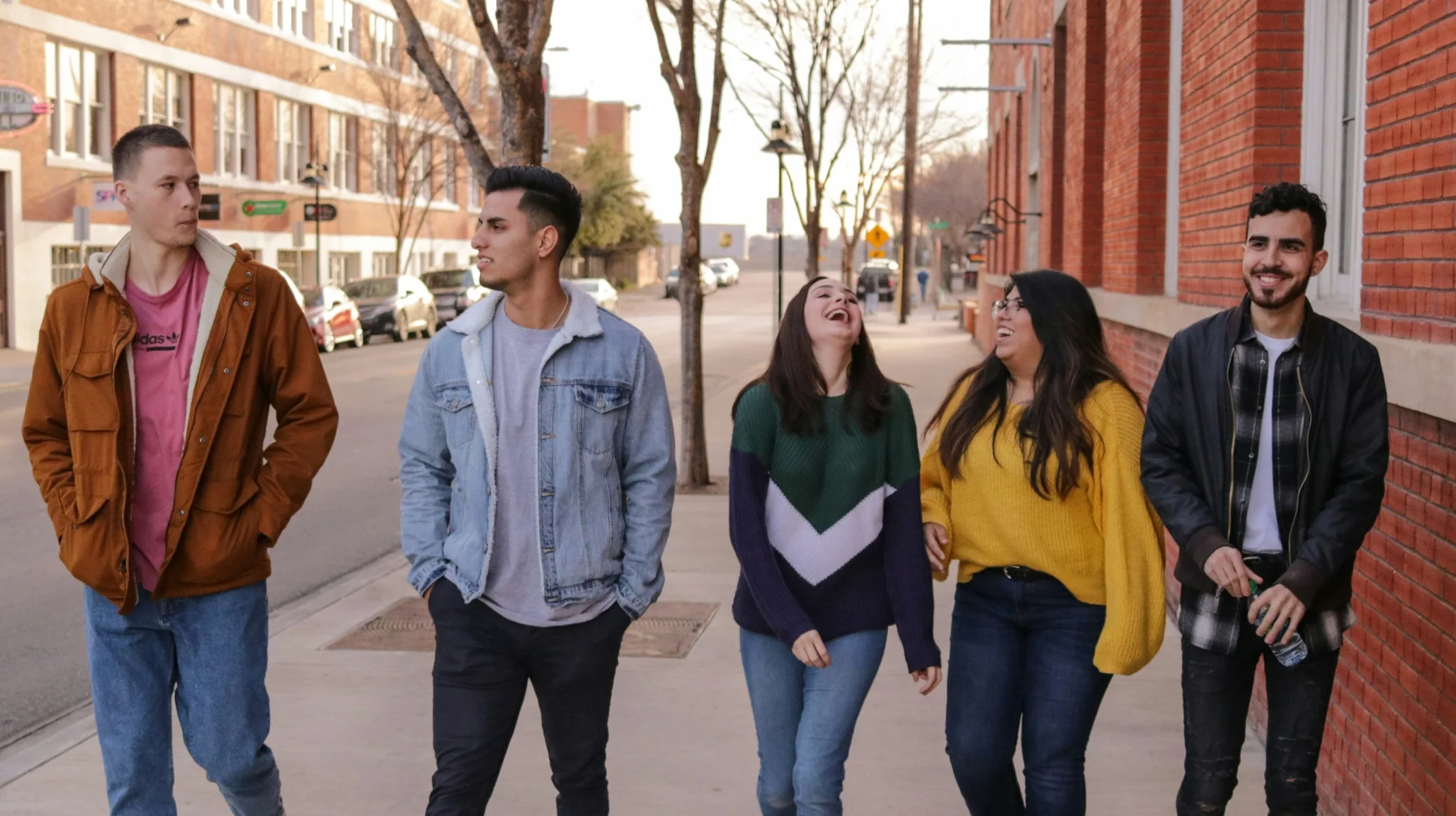 Five high school students walking together in downtown Bakersfield as part of the Kern County Student Leadership program focused on leadership, confidence, and community engagement.