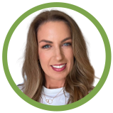 A portrait of a smiling woman with long light brown hair, wearing a white top, framed by a green circular border.
