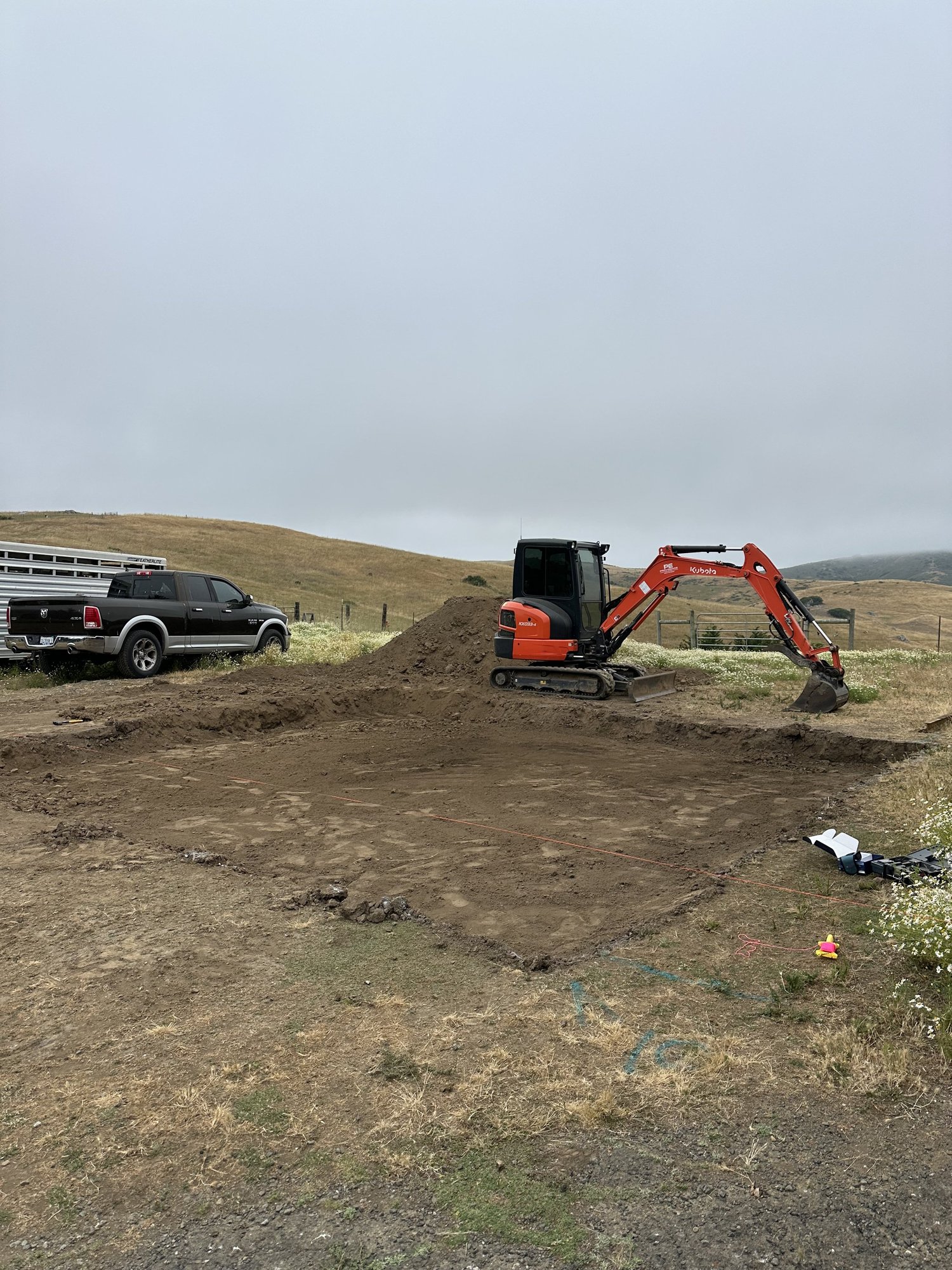 Mini excavator preparing a building site