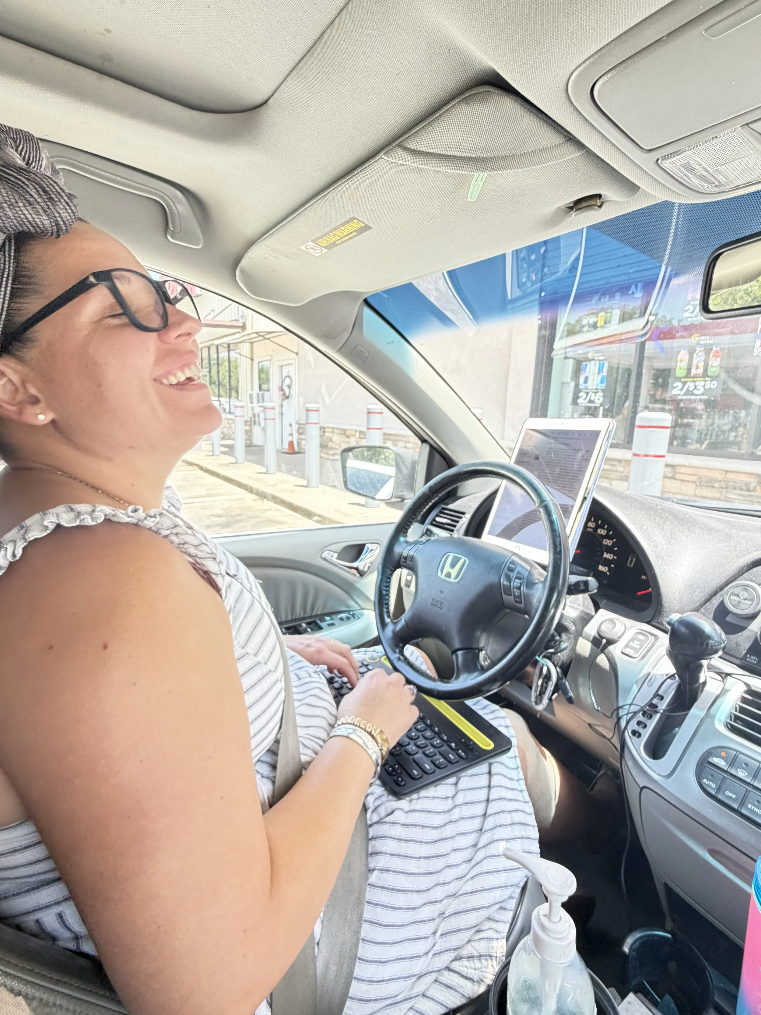 Working in the car at a gas station trip stop