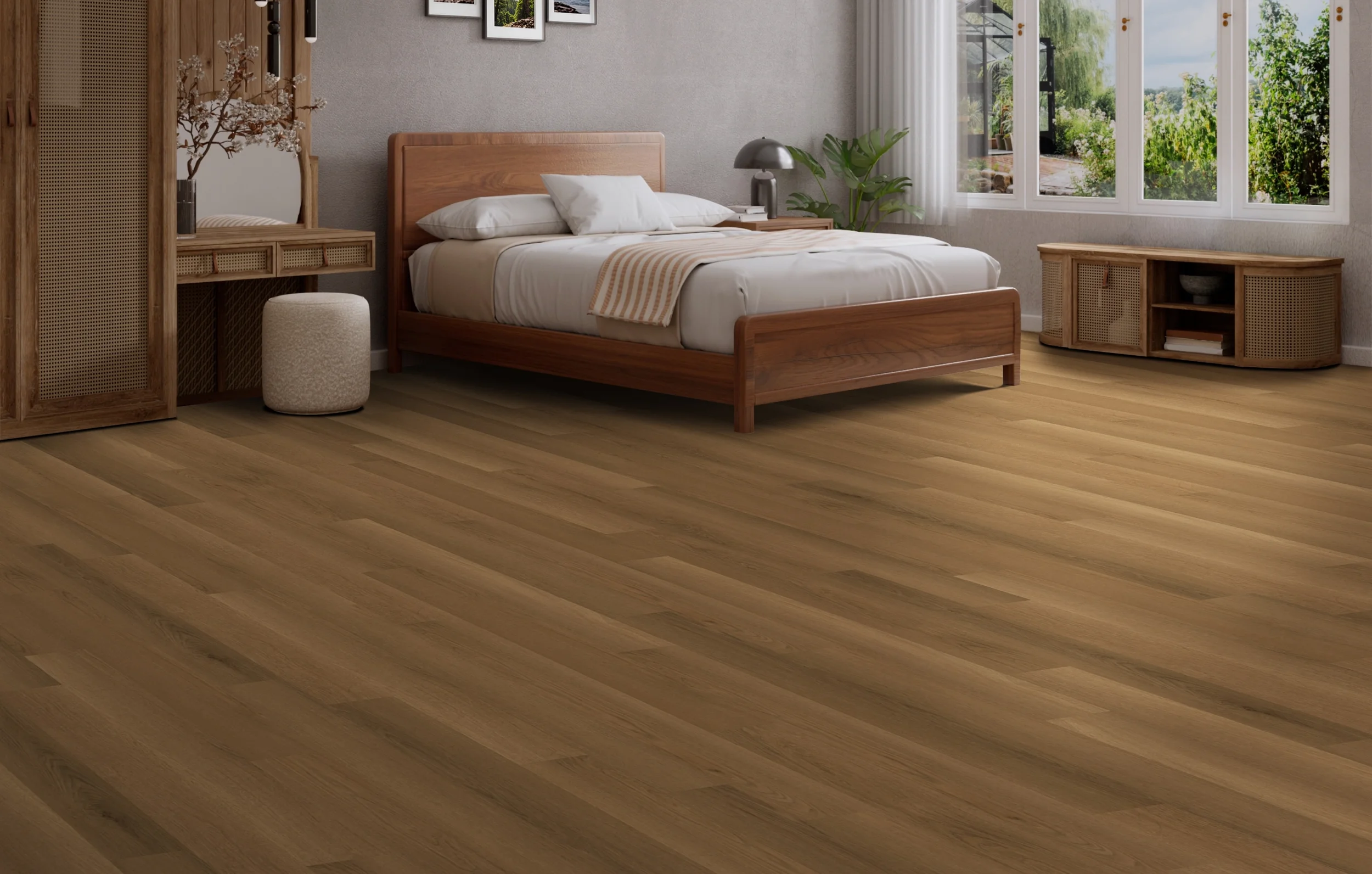 PROJEX Rigid Core vinyl flooring in Cognac Oak, installed in a bedroom with a garden view.
