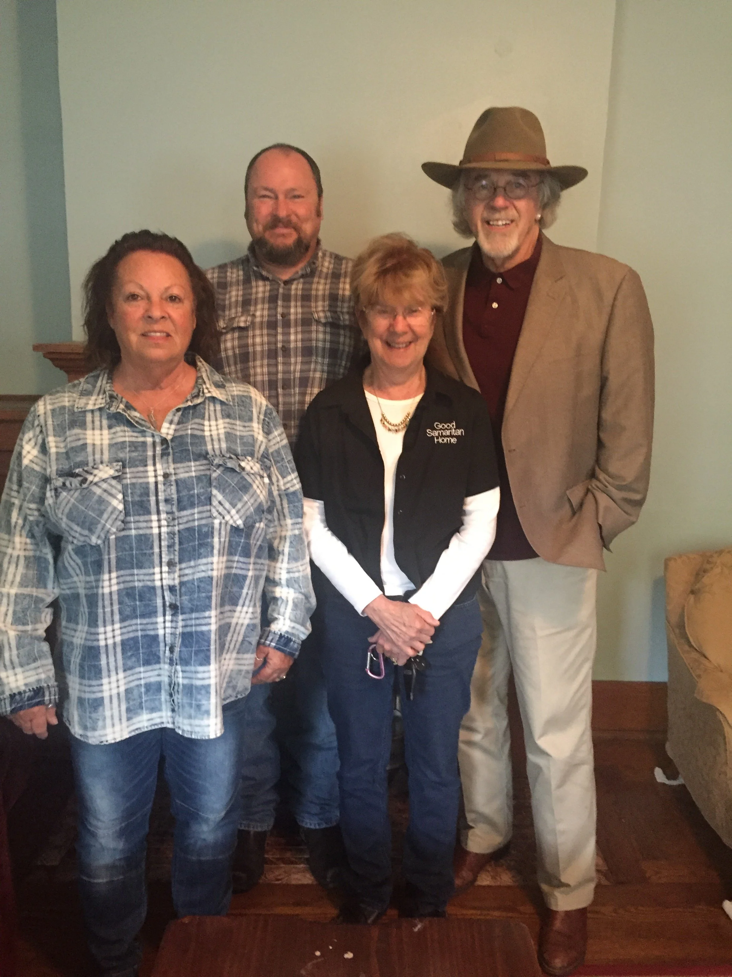 Dr. John Graham and wife Kathy Graham working with employees of GSH.