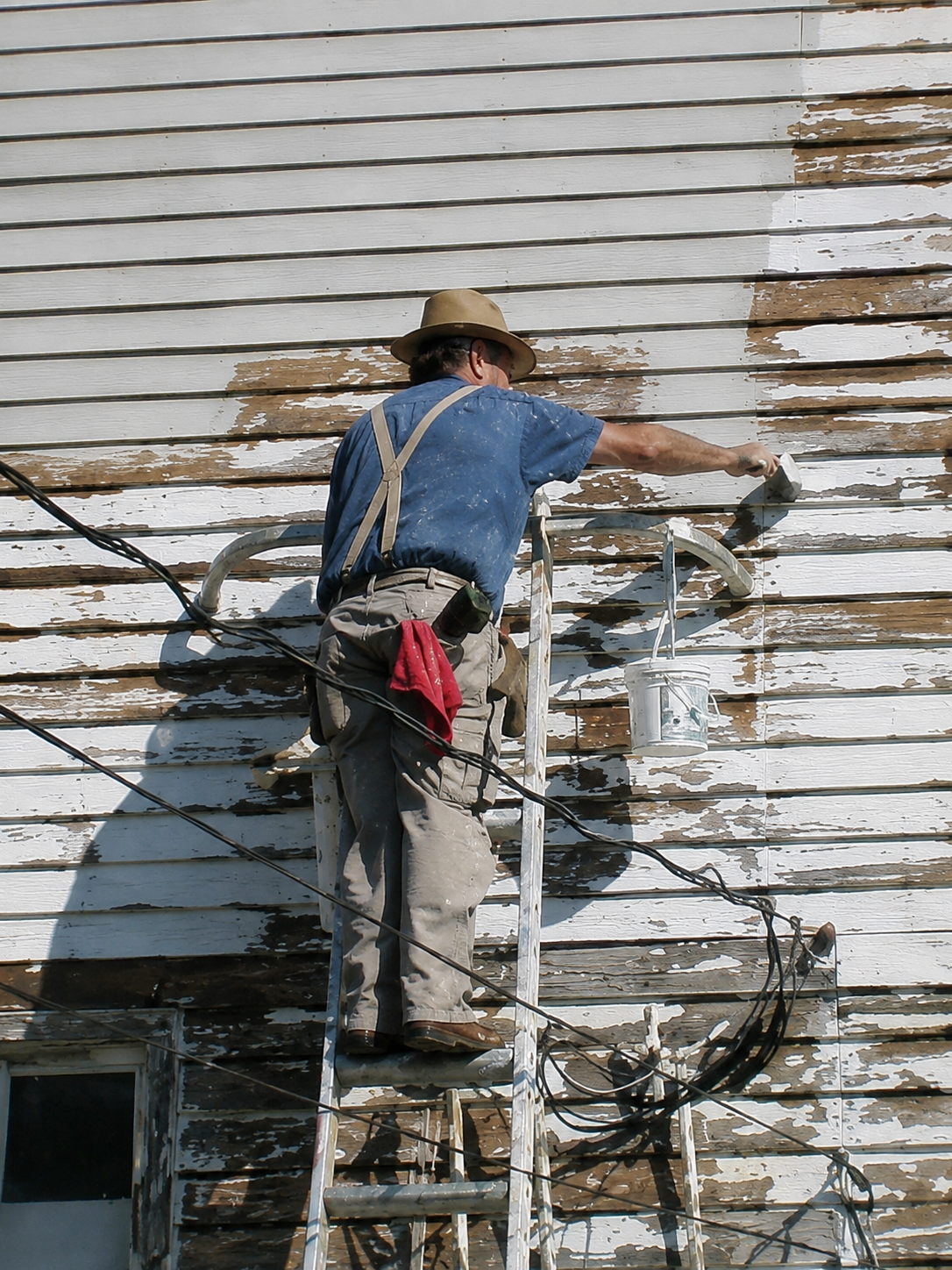 Dr. John Graham rebuilding a house one at a time, the same way he helped to rebuild lives.