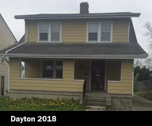 A two-story yellow house with a dark roof and front steps, located in Dayton in 2018 depicting Good Samaritan Home's housing expansion for those looking for re-entry. 