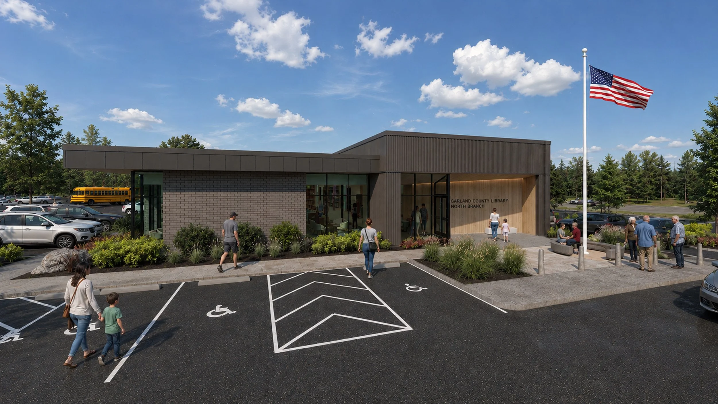 A modern community library building with a parking lot in the foreground, including accessible parking spots, and an American flag flying on a flagpole near the entrance. Several people are walking towards and around the library, with trees and a blu
