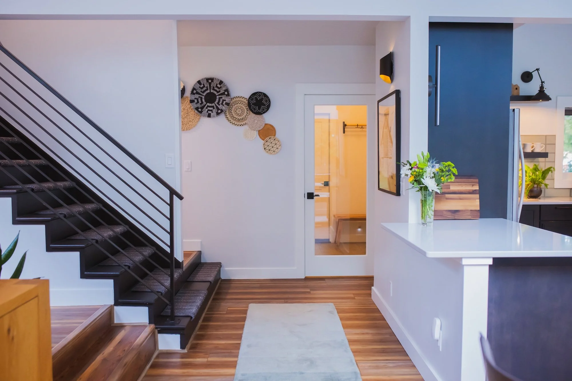Modern interior of a house with staircase and decorative wall art