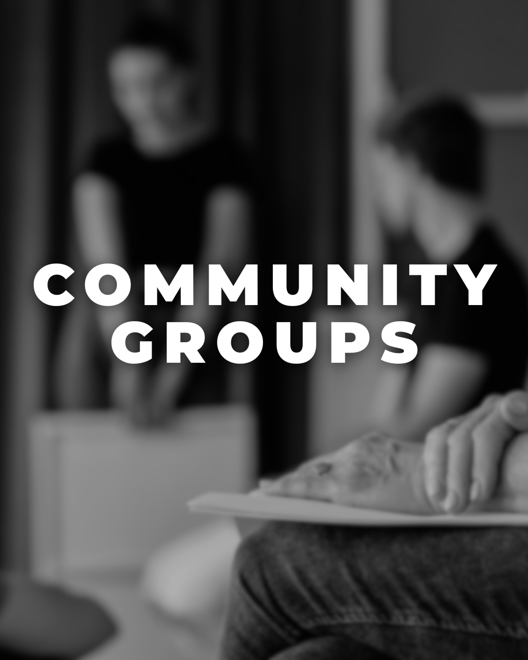 Black and white photo of two women having a conversation, one holding documents, with bold text overlay reading 'Community Groups'