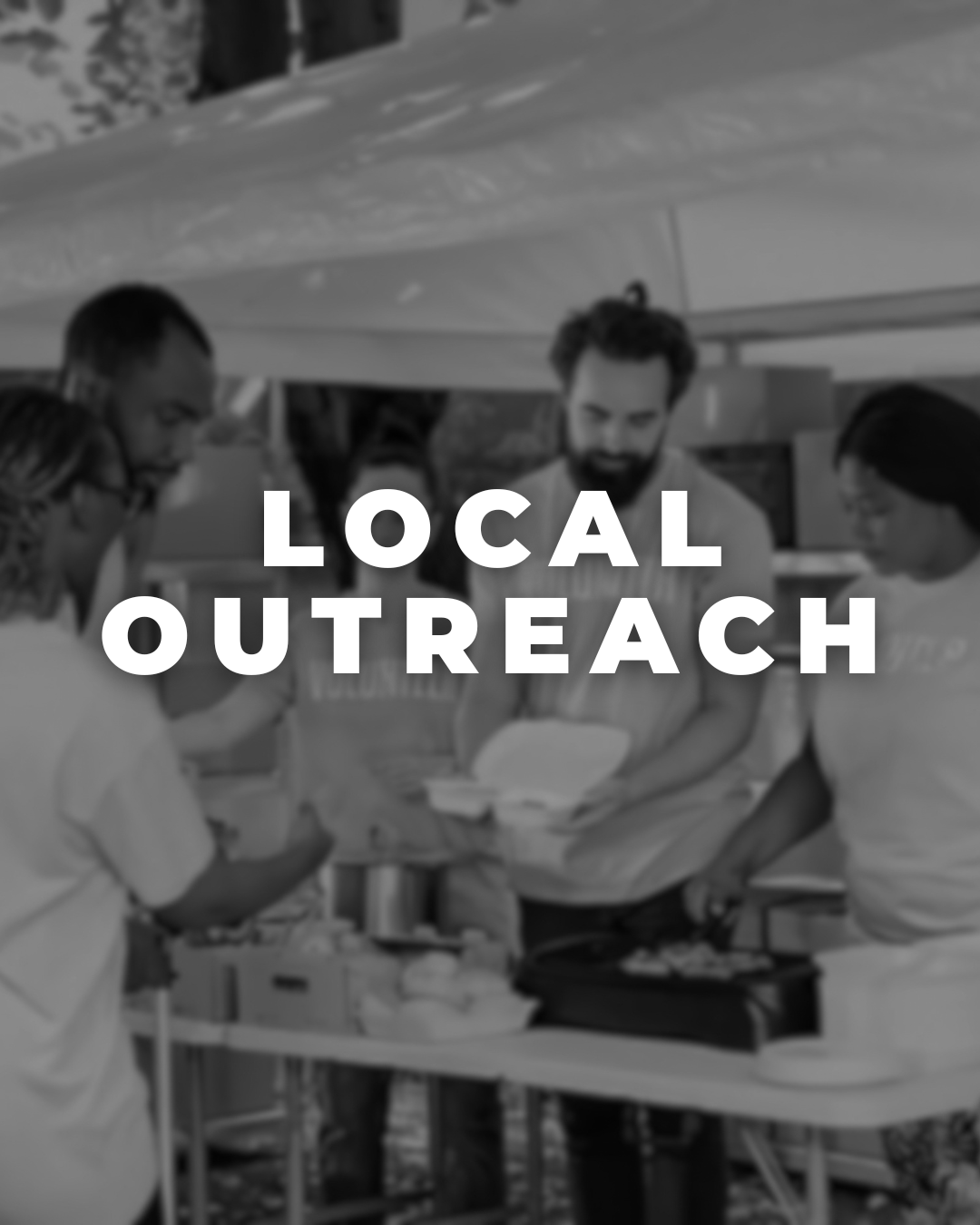 People gathered around a table outdoors, preparing food under a canopy, with the text 'Local Outreach' overlaid.