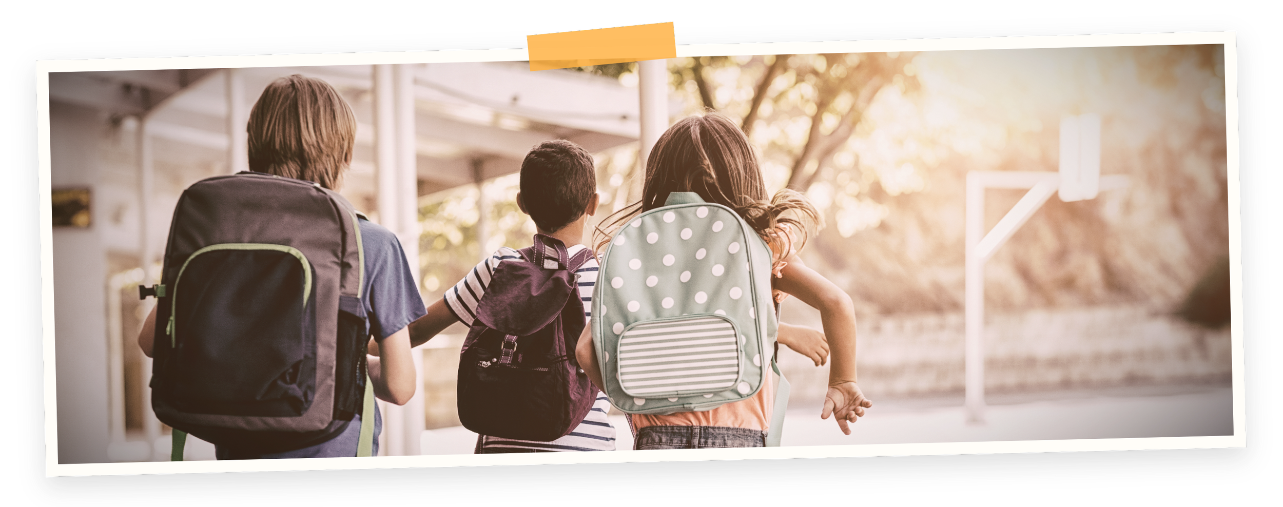 After school program in Marpole. Arbutus Kids World. Four children with backpacks walking outdoors on a sunny day.