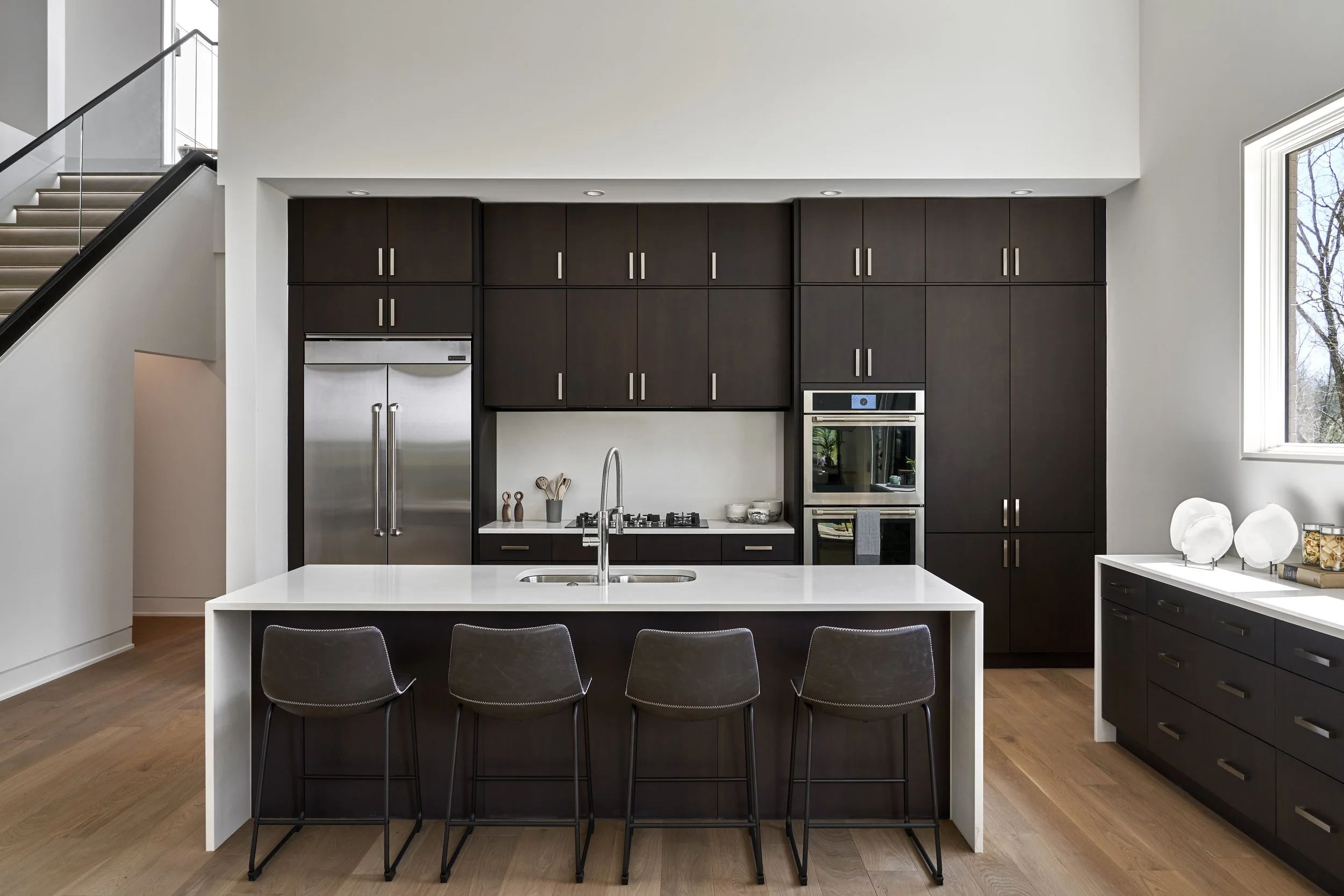 kitchen, fridge, ovens, cooktop, island, plates, range, refrigerator, stairs, glass, cabinets, kitchen cabinets, sink, faucets, marble, quartz, bar seats, buffet