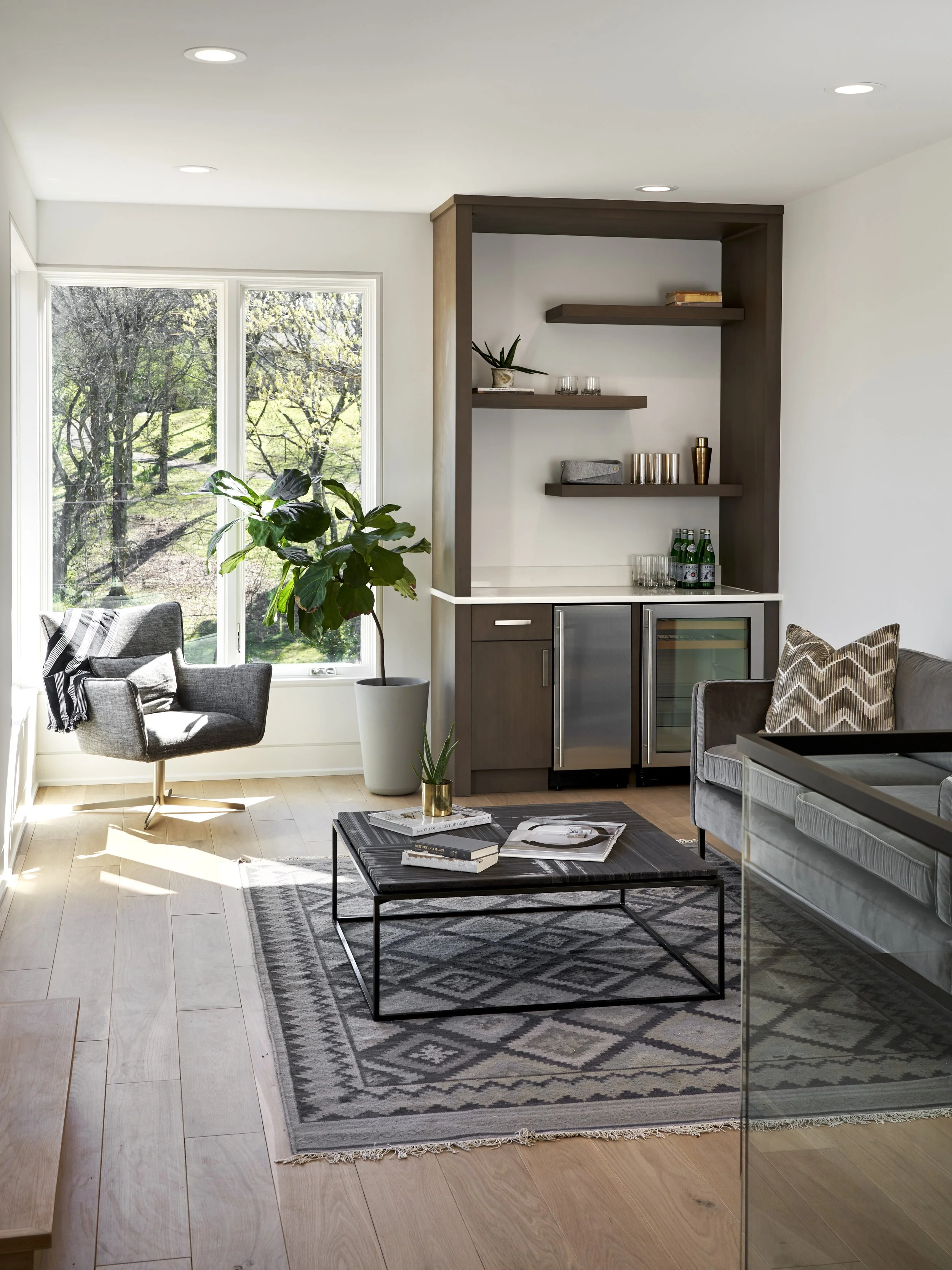 rug, hardwood flooring, wine storage, beverage cooler, ice machine, sofa, coffee table, chair, window