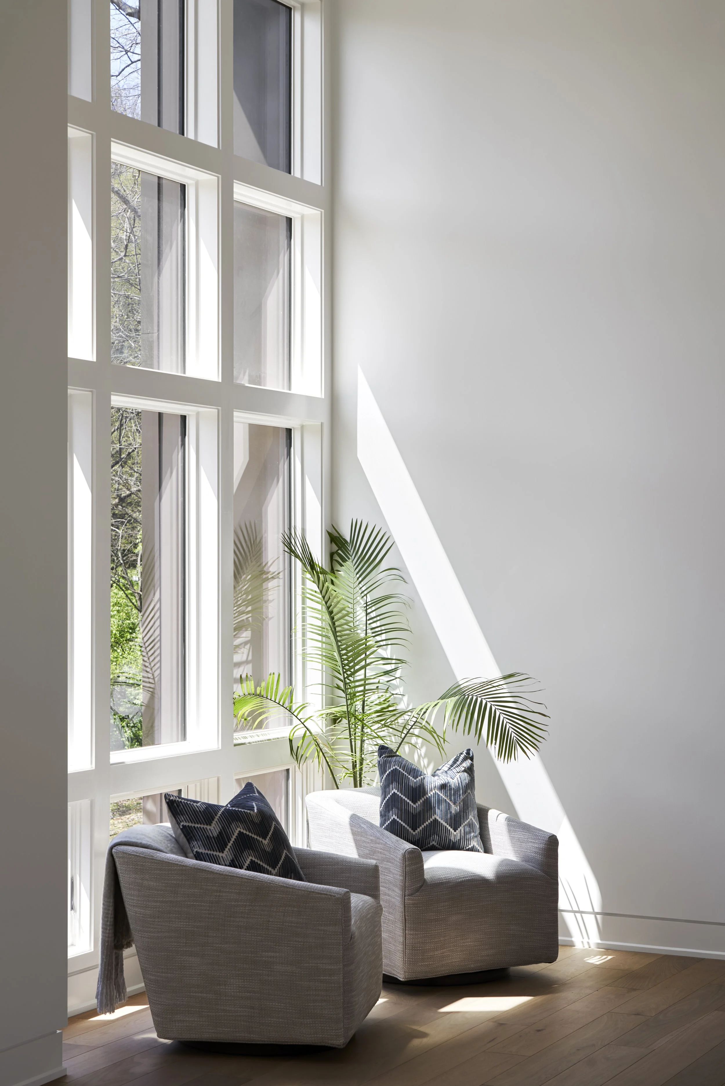 large window, chairs, seats, plants, flooring, decorative pillows, sunshine, windows