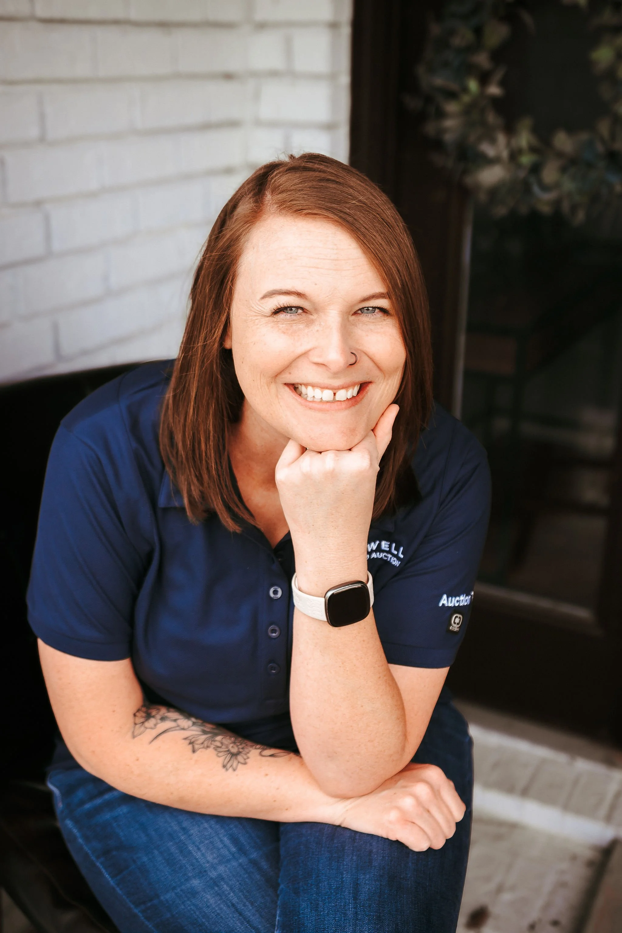 Natalie Rich, licensed Tennessee Affiliate Broker and Middle Tennessee native, smiling in a navy Blackwell Realty shirt.