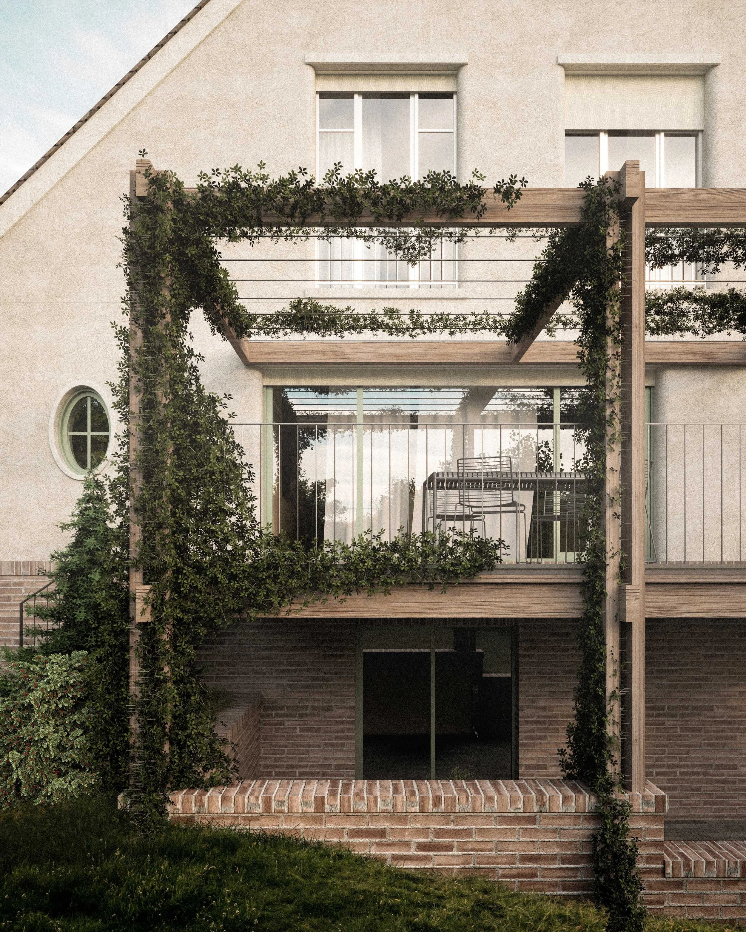 The exterior of a modern house with two floors. The house has a beige stucco upper level, brick lower level, and a small balcony with wooden railings decorated with green vines. There is a sliding glass door, a small round window, and a brick staircase at the entrance leading to a paved porch.