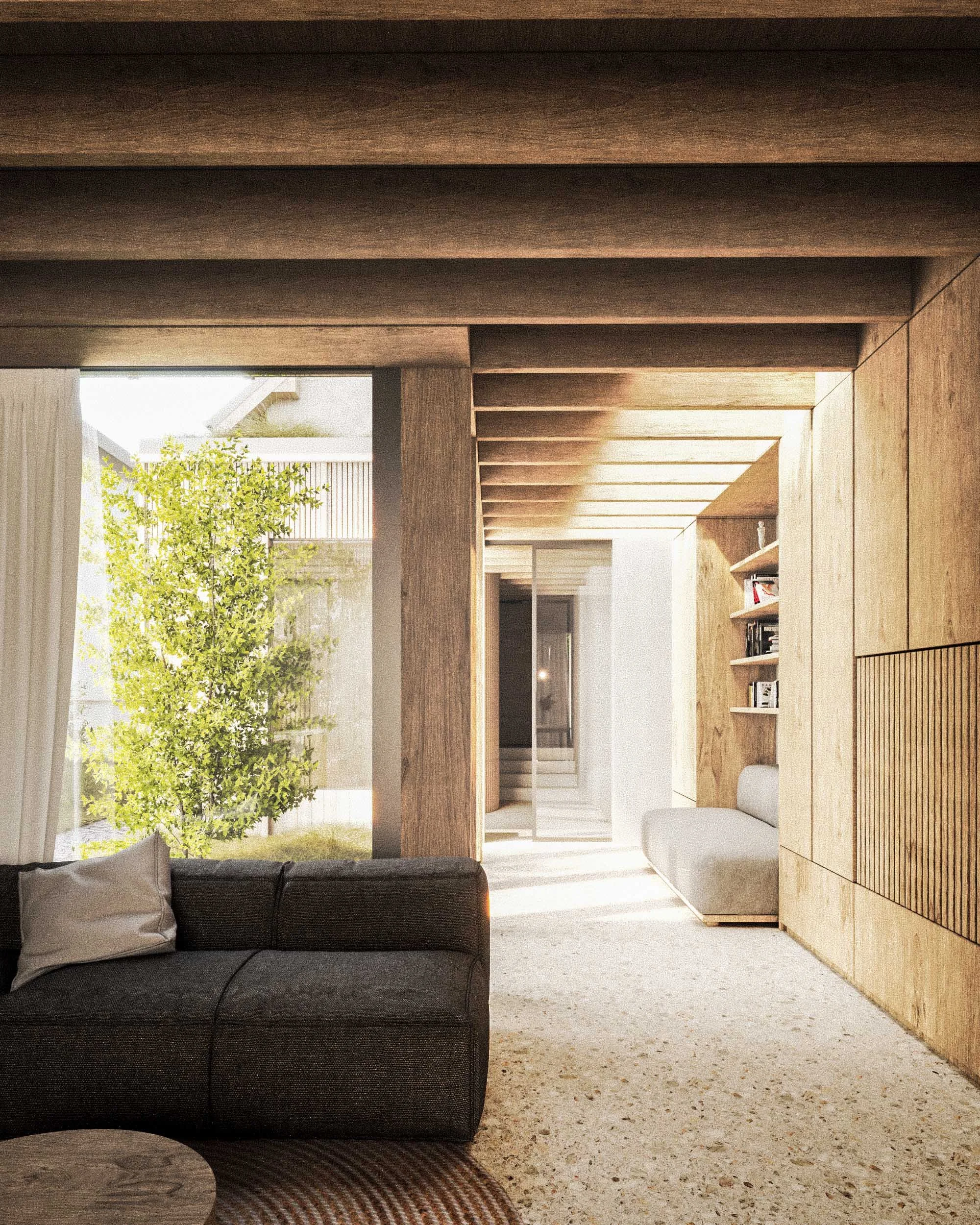 Living room with a dark sofa, a wooden coffee table, a beige textured rug, and a large window showing greenery outside.