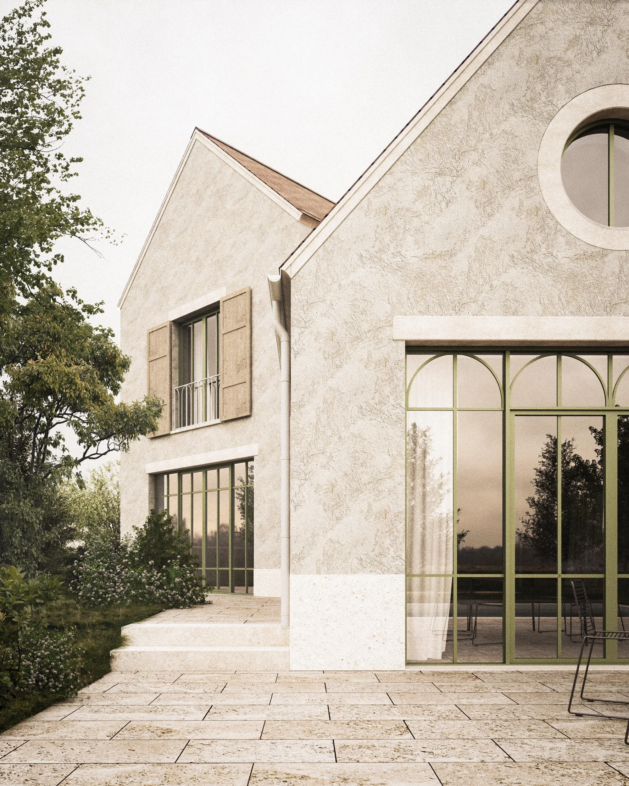 View of a modern house exterior with large glass windows, beige stucco walls, a tiled patio, and greenery on the side.