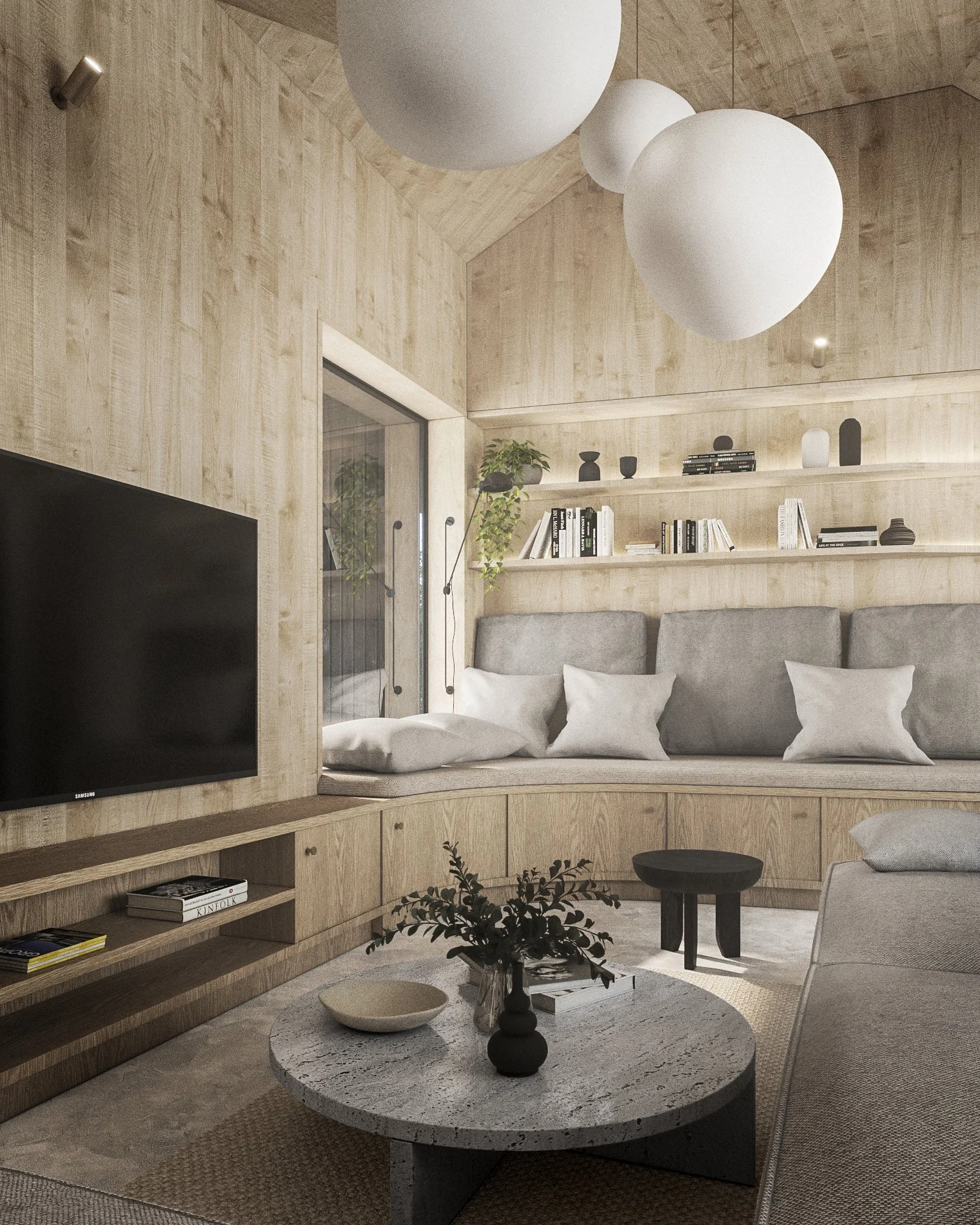 Living room with wooden panel walls, a curved built-in wooden bookshelf with books and decorative objects, a gray sofa with pillows, a black round side table, a round coffee table with vases and plants, a mounted TV, and large white spherical pendant lights hanging from the ceiling.