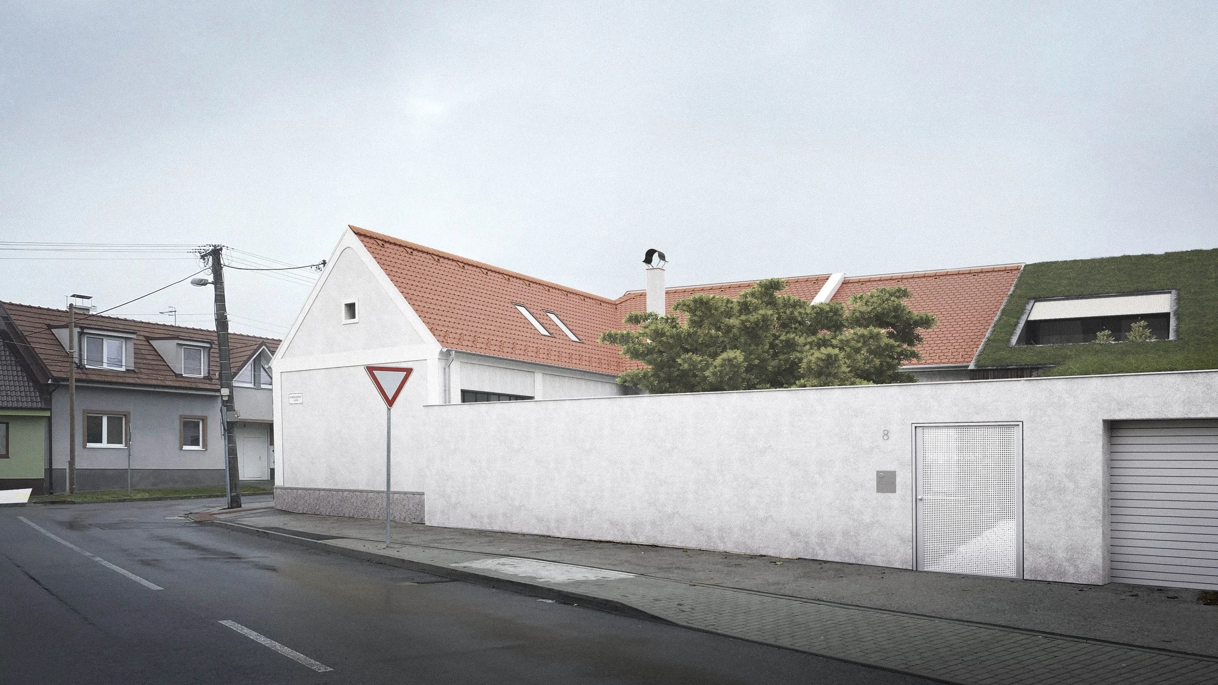 Residential street with houses, including one with a green roof and a chimney with a bird sculpture, power lines, a street sign, and a tall white wall.
