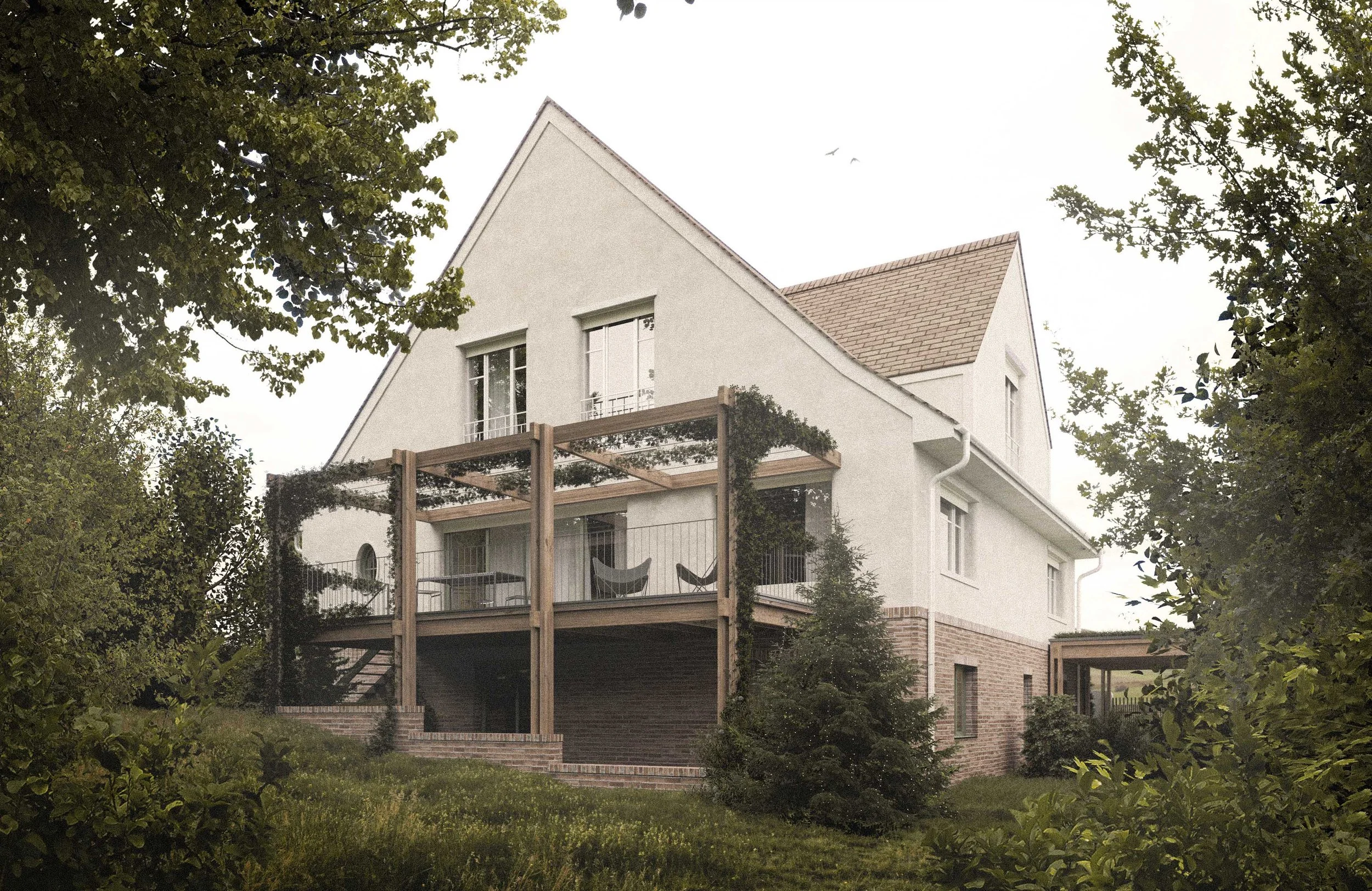 A white house with a sloped roof, multiple windows, and a balcony with a pergola, surrounded by trees and greenery.