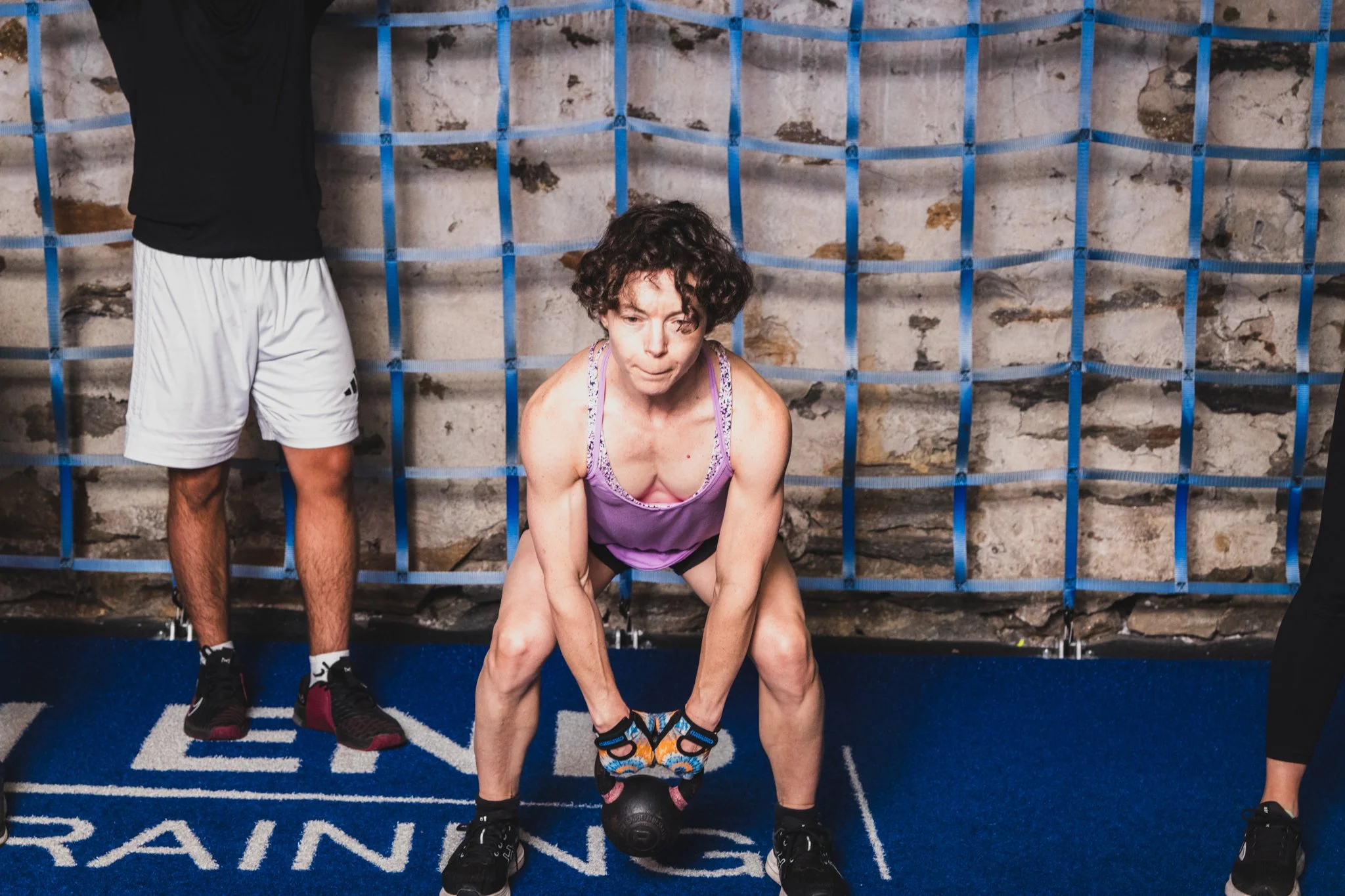 Woman participating in a strength training class at North End Fitness & Training