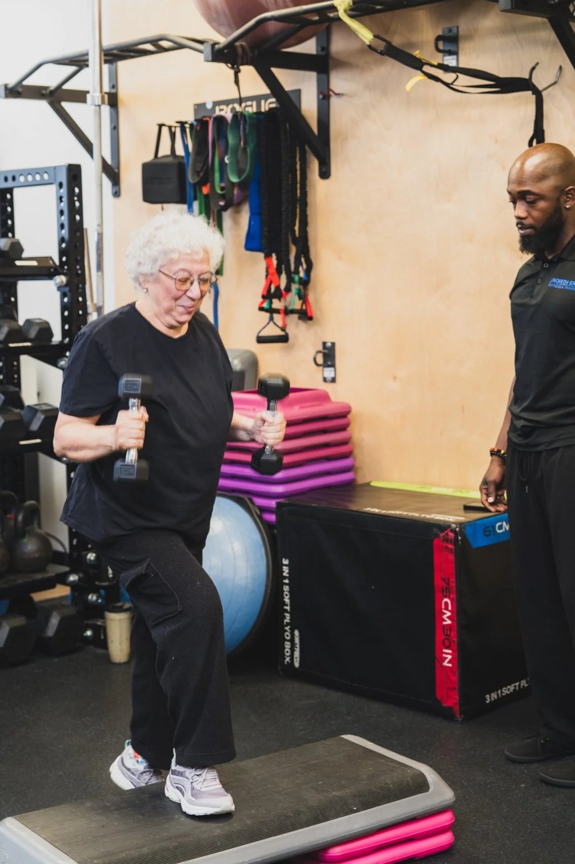 Personal trainer coaching a senior client through a strength session at North End Fitness in New Rochelle, NY