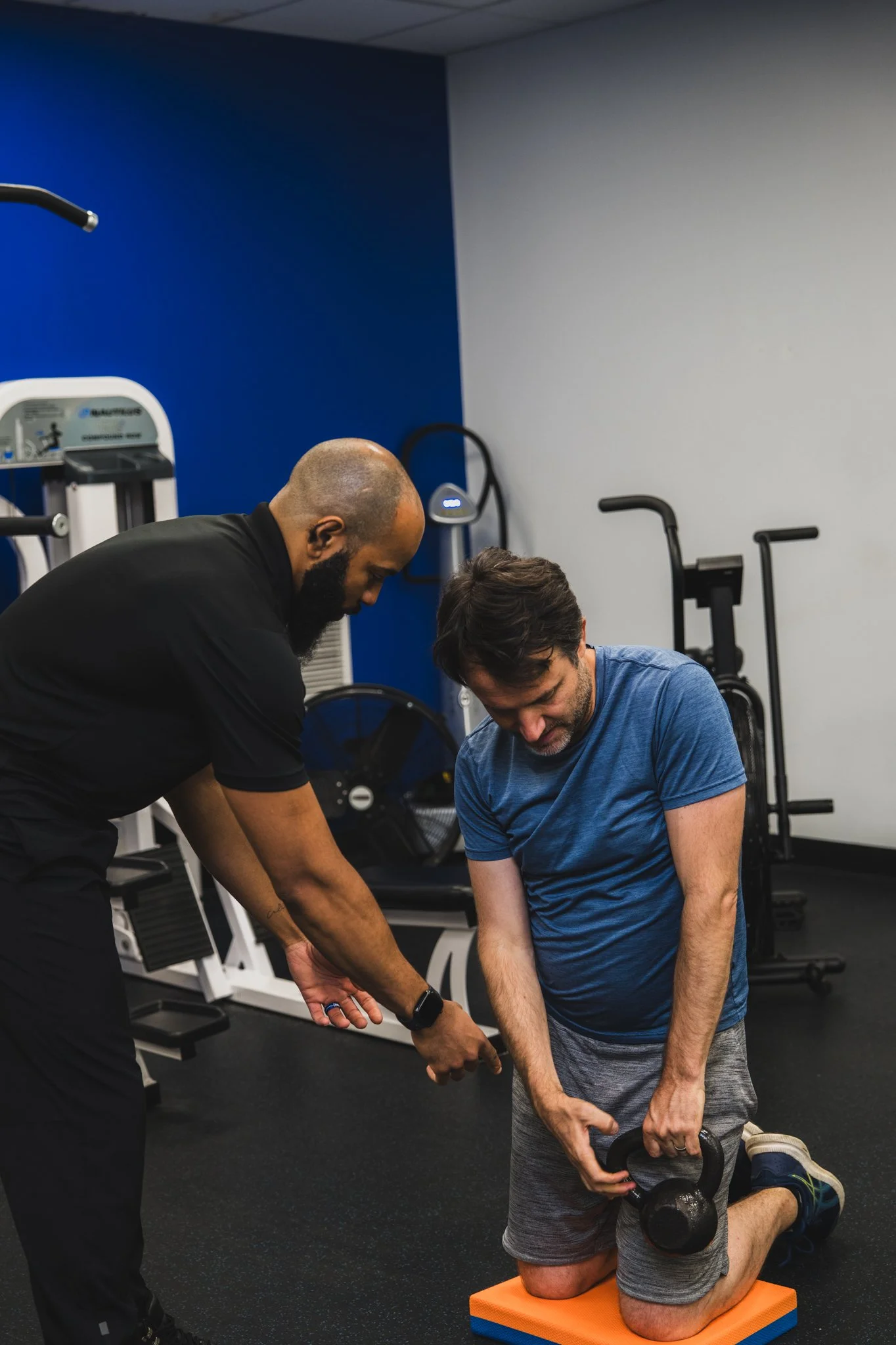 Personal trainer coaching a client through a strength session at North End Fitness in New Rochelle, NY