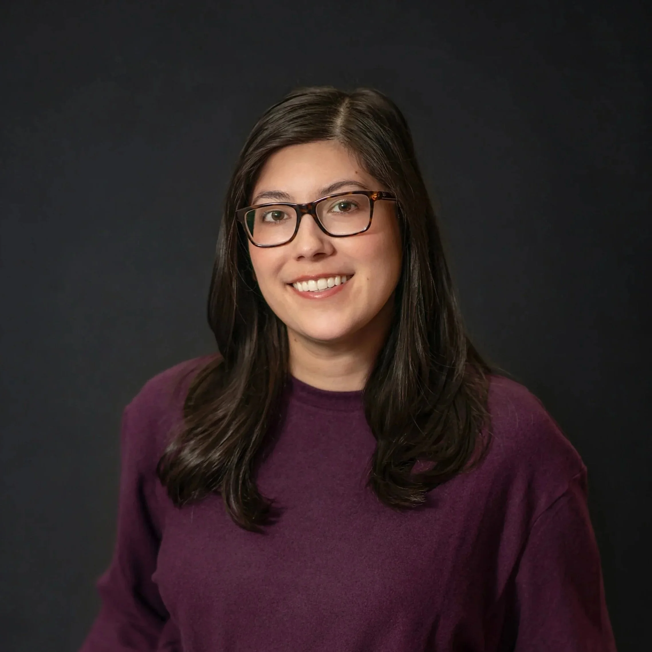 Happy Woman with Dark Hair and Navy blue sweater