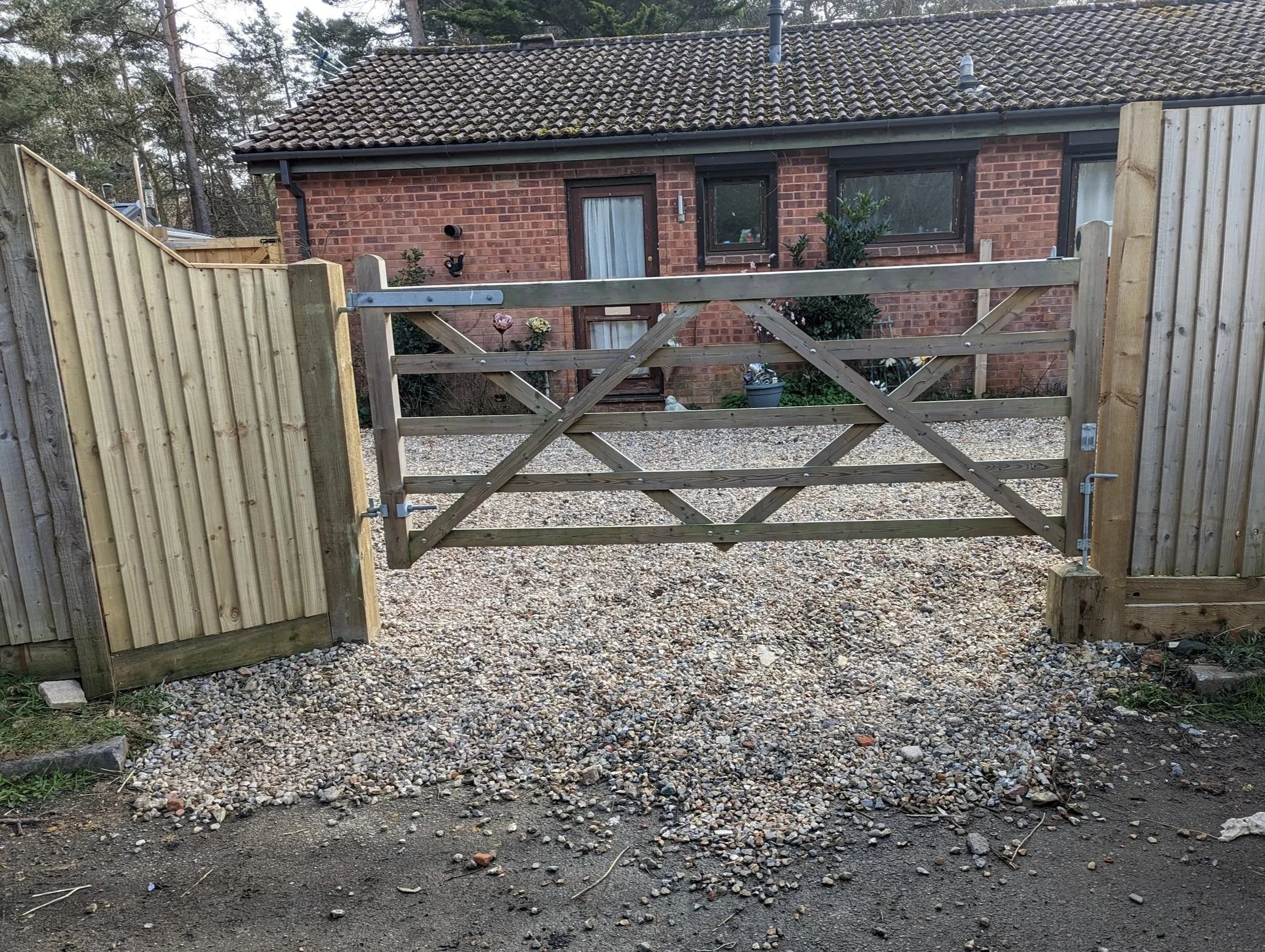 Installed new gate and extra fence panel