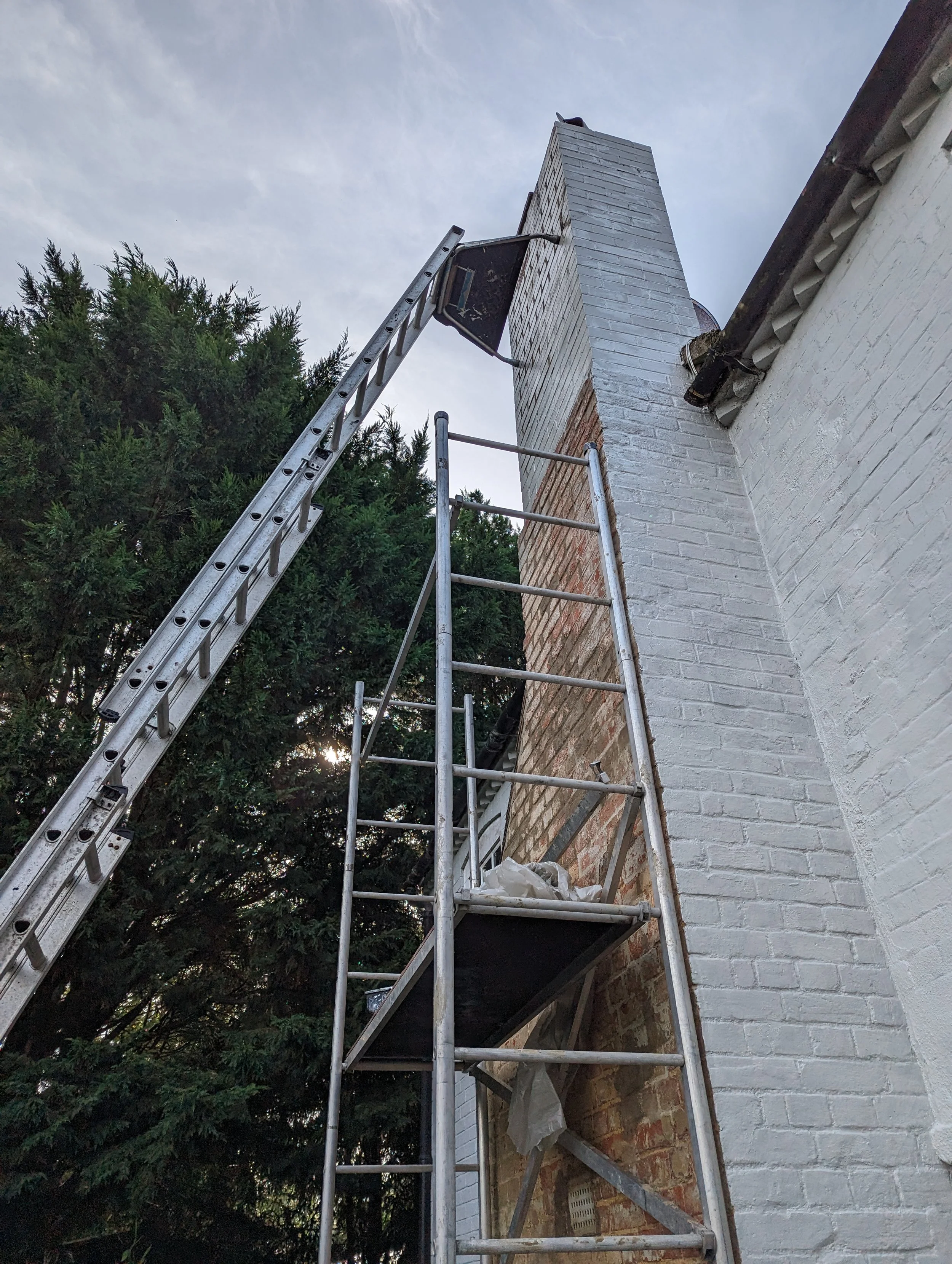 Removed render & growing plantation then cleaned and re-pointed brickwork on a chimney breast