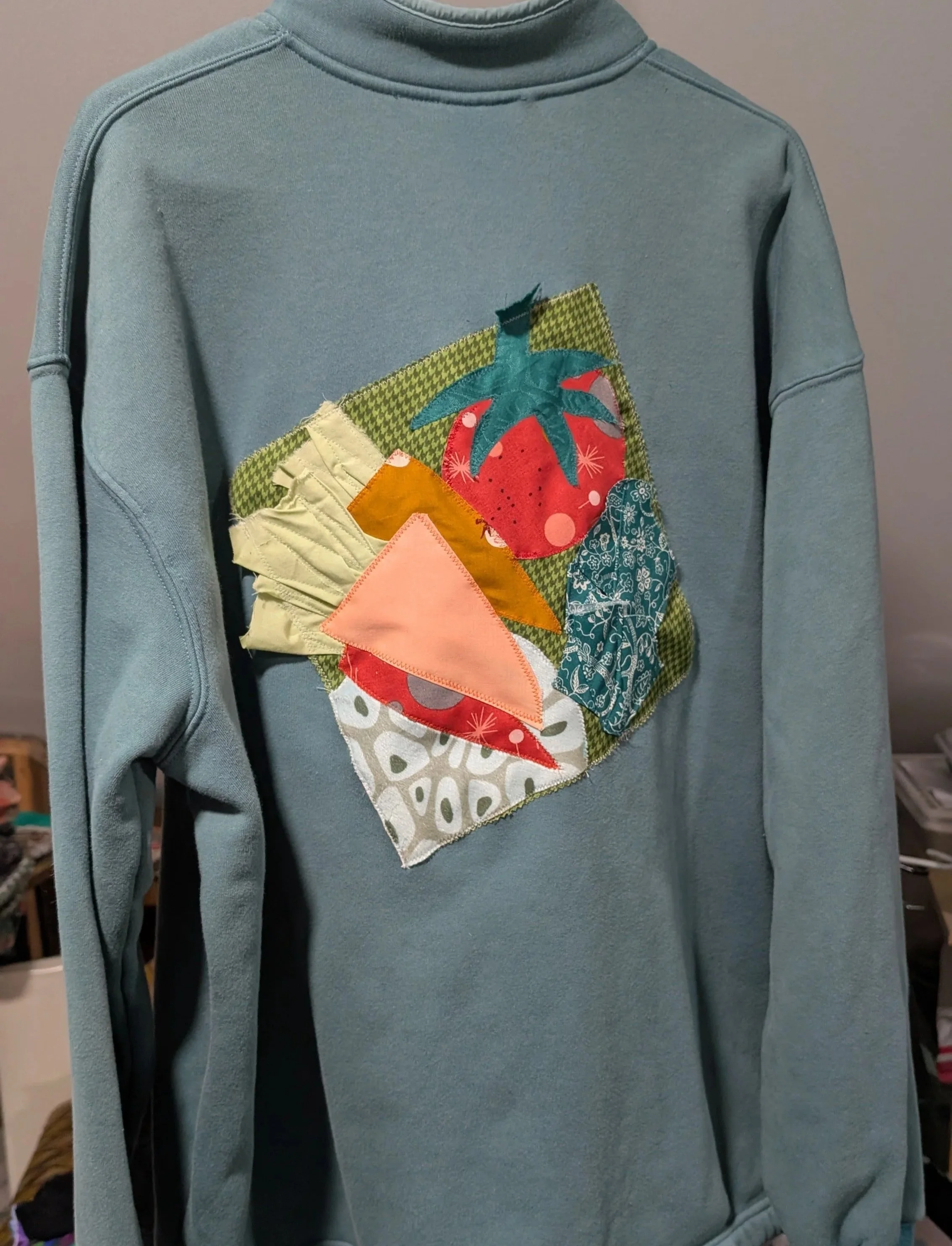 blue grey sweatshirt with vegetable applique
