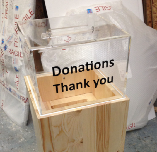 A transparent donation box with