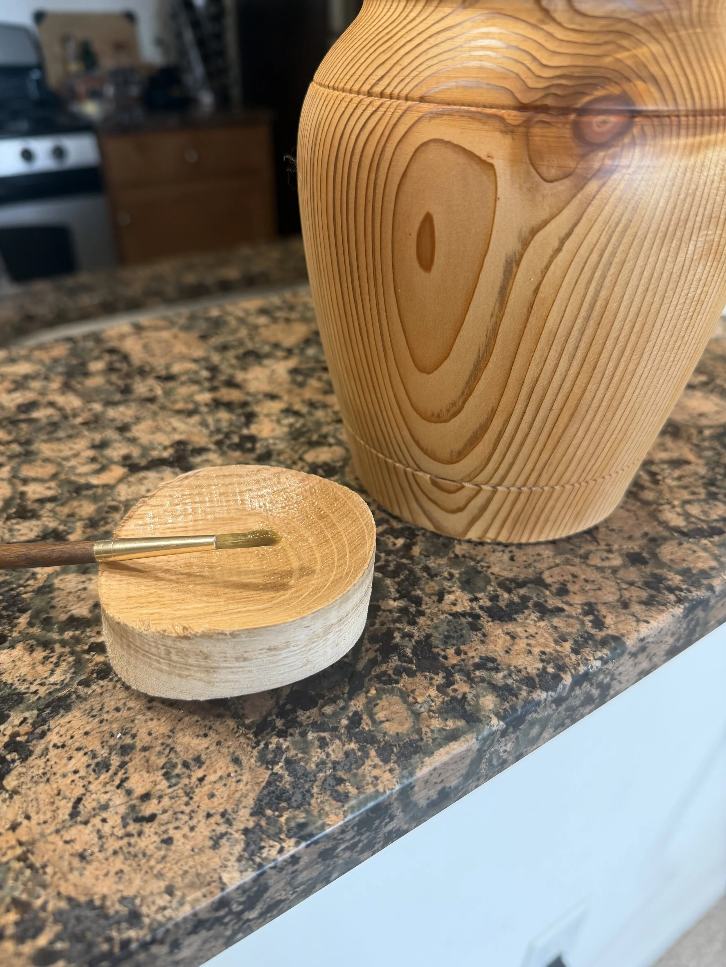 Putting the finishing touches on a wooden vessel