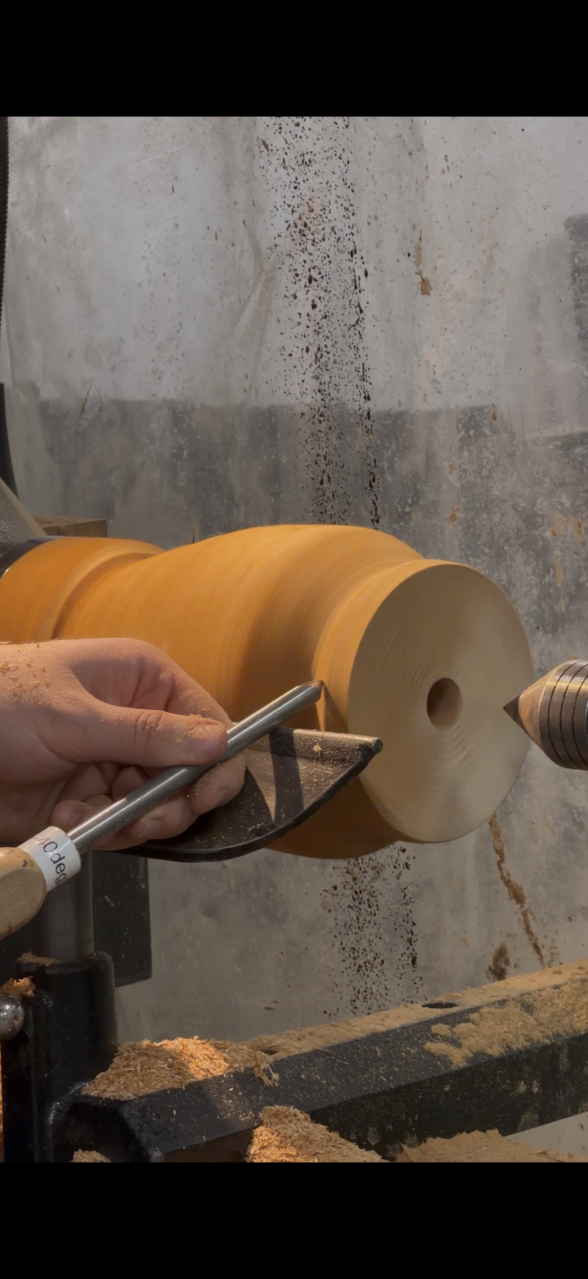 Using bowl gouge on a lathe to turn a custom urn
