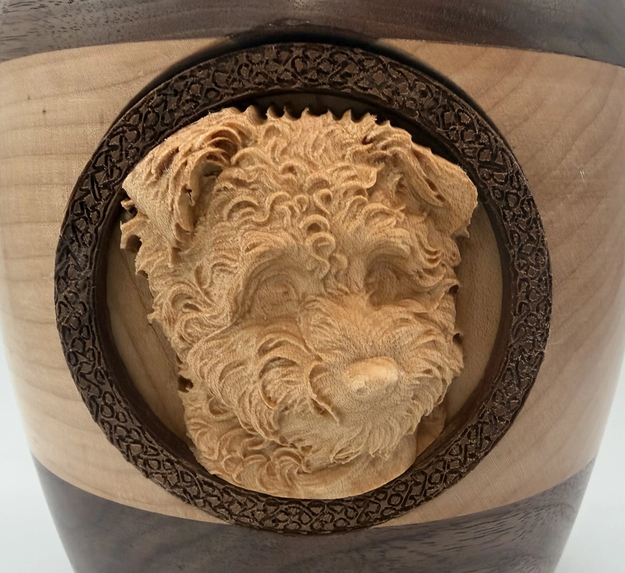Closeup of custom urn for dog carving