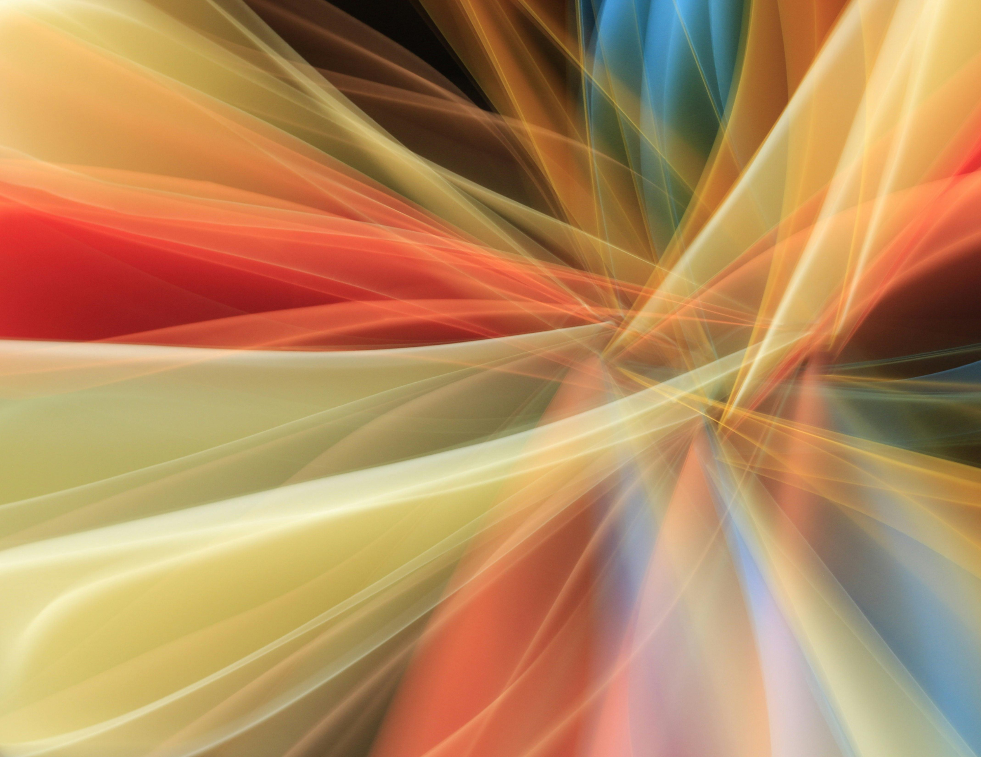 Abstract digital art with flowing light trails in yellow, orange, blue, and black colors.