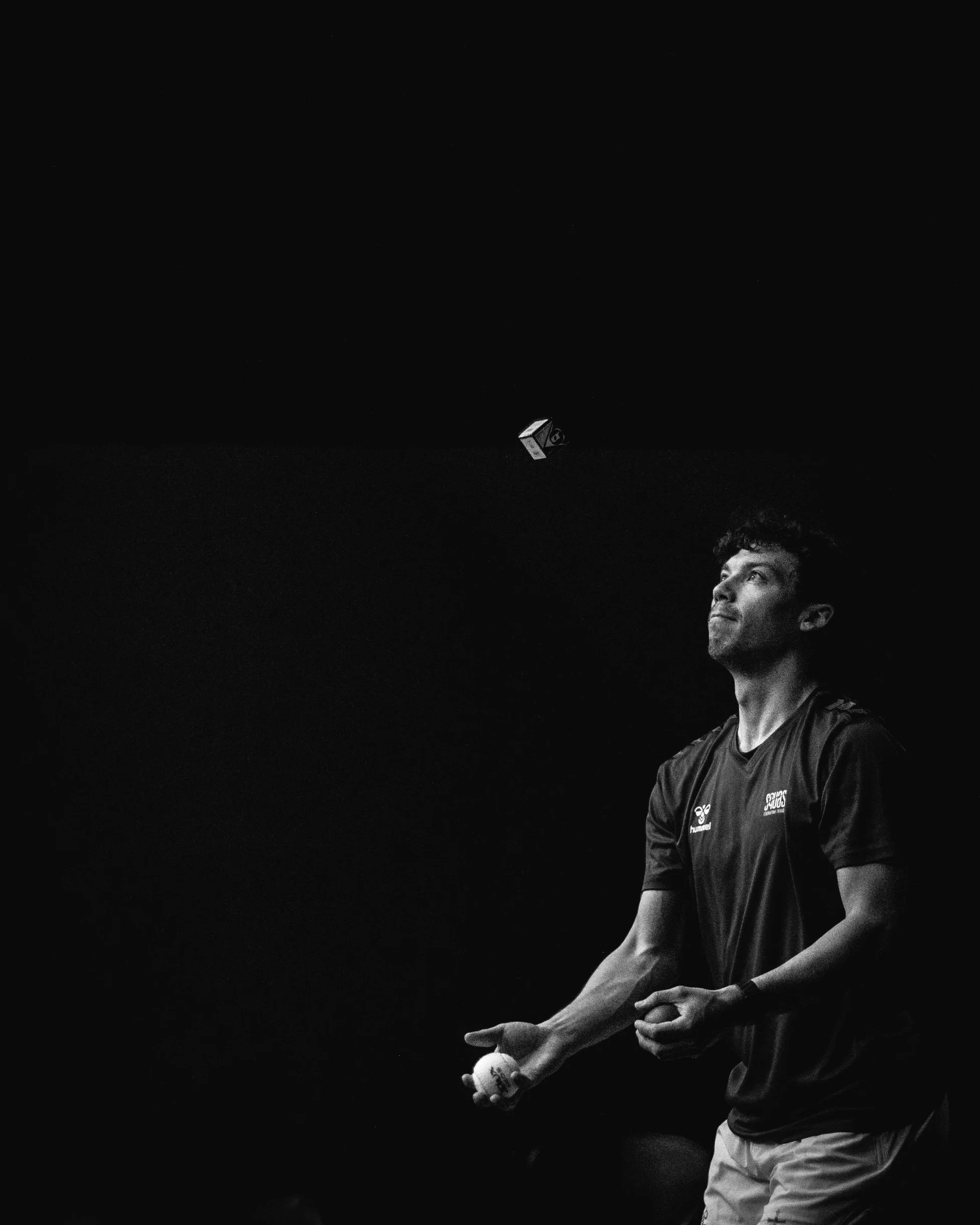 Squash player Victor Crouin juggles as part of his practise session warm up