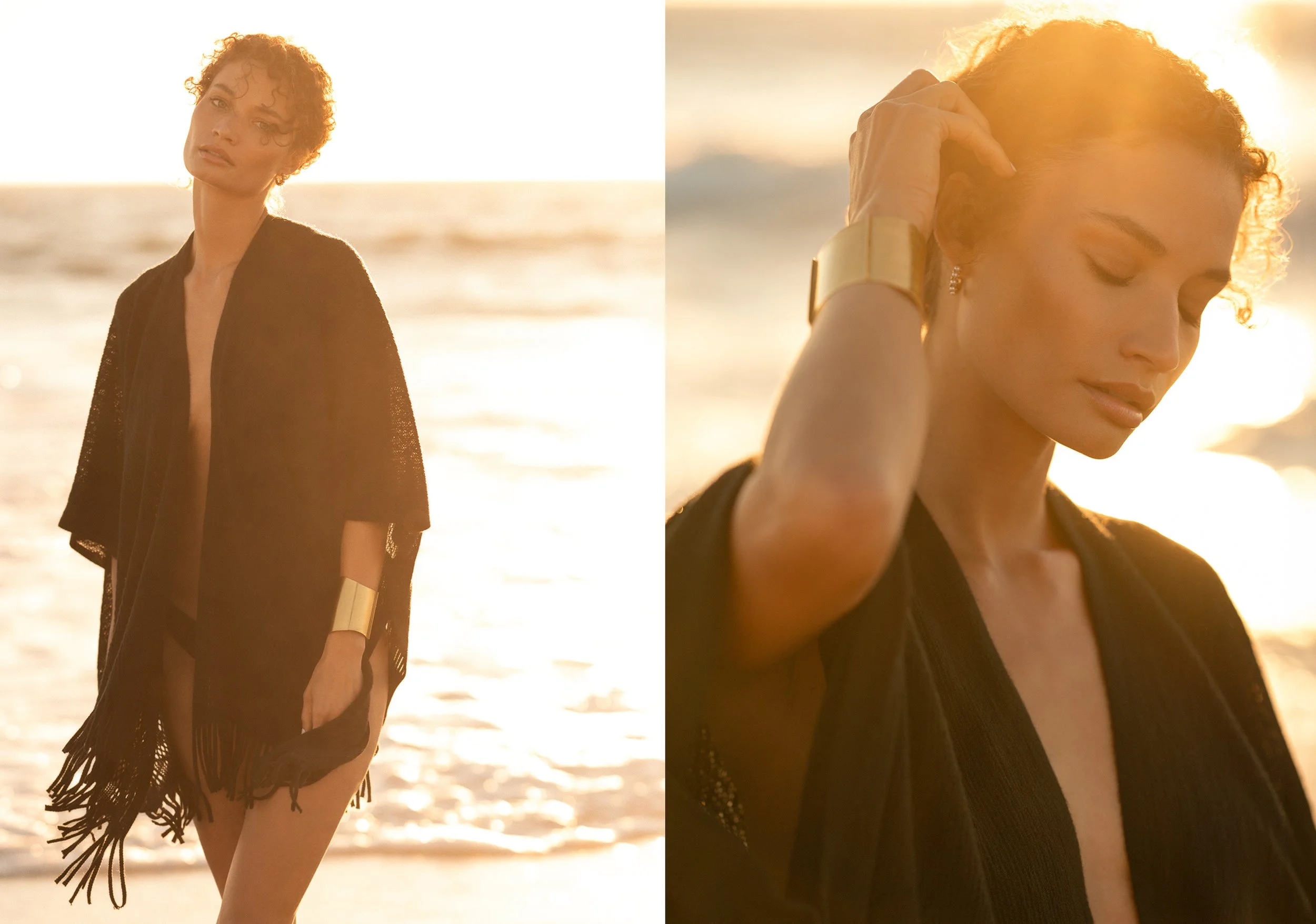 A woman with curly hair wearing a black cover-up over a swimsuit standing on the beach at sunset, with the ocean and golden light in the background. Fashion, resort, swimwear, luxury lifestyle photographer. 