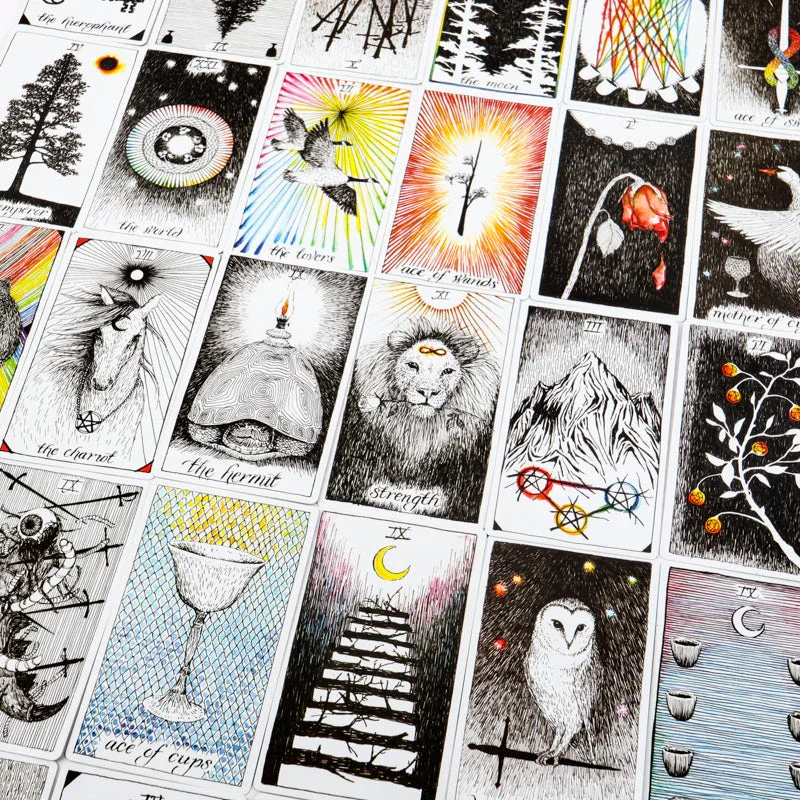 A collection of tarot cards displayed in a grid, each with black and white line art and some with colorful accents.