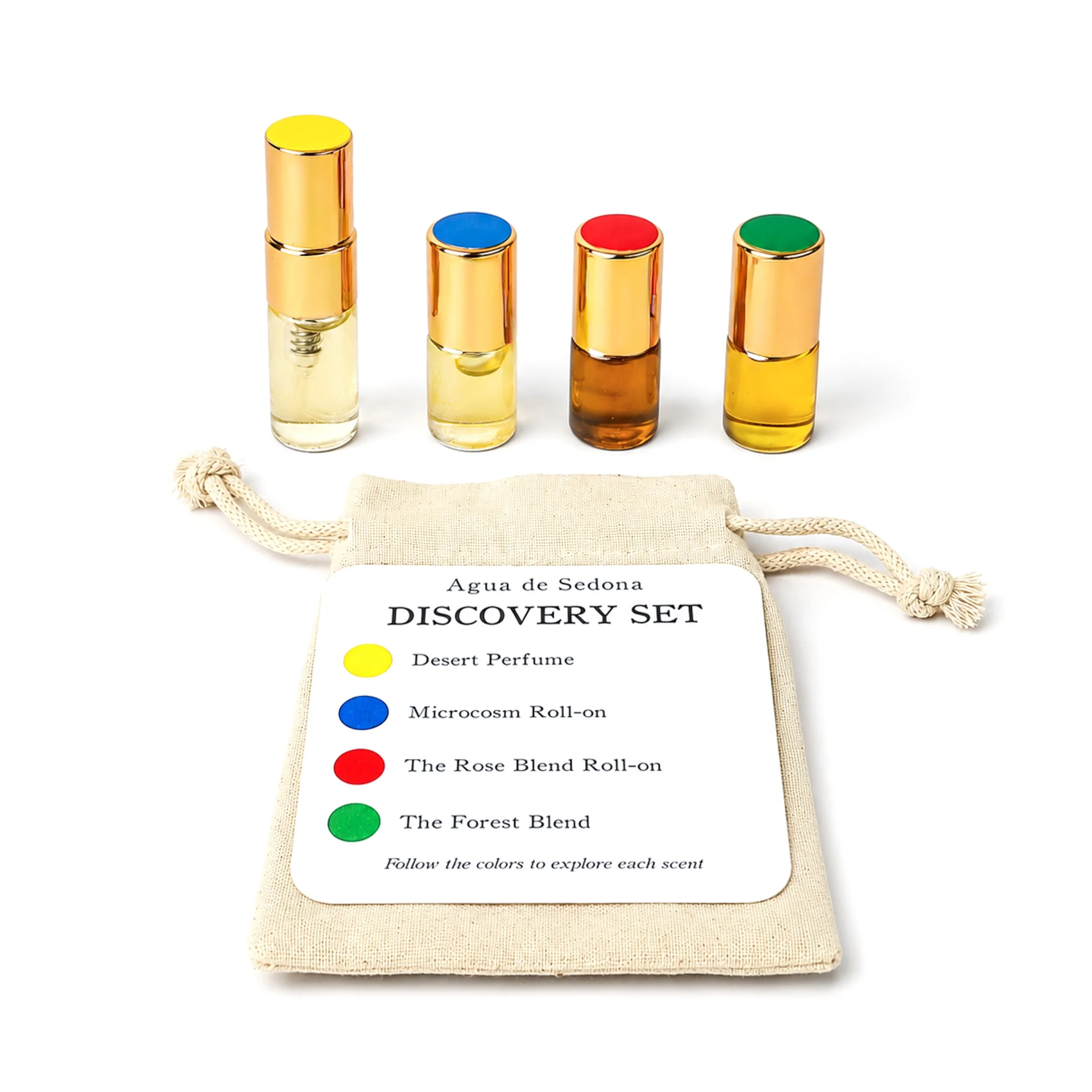 A discovery set of essential oils in small glass bottles with colored caps, accompanied by a drawstring pouch and a scent guide.