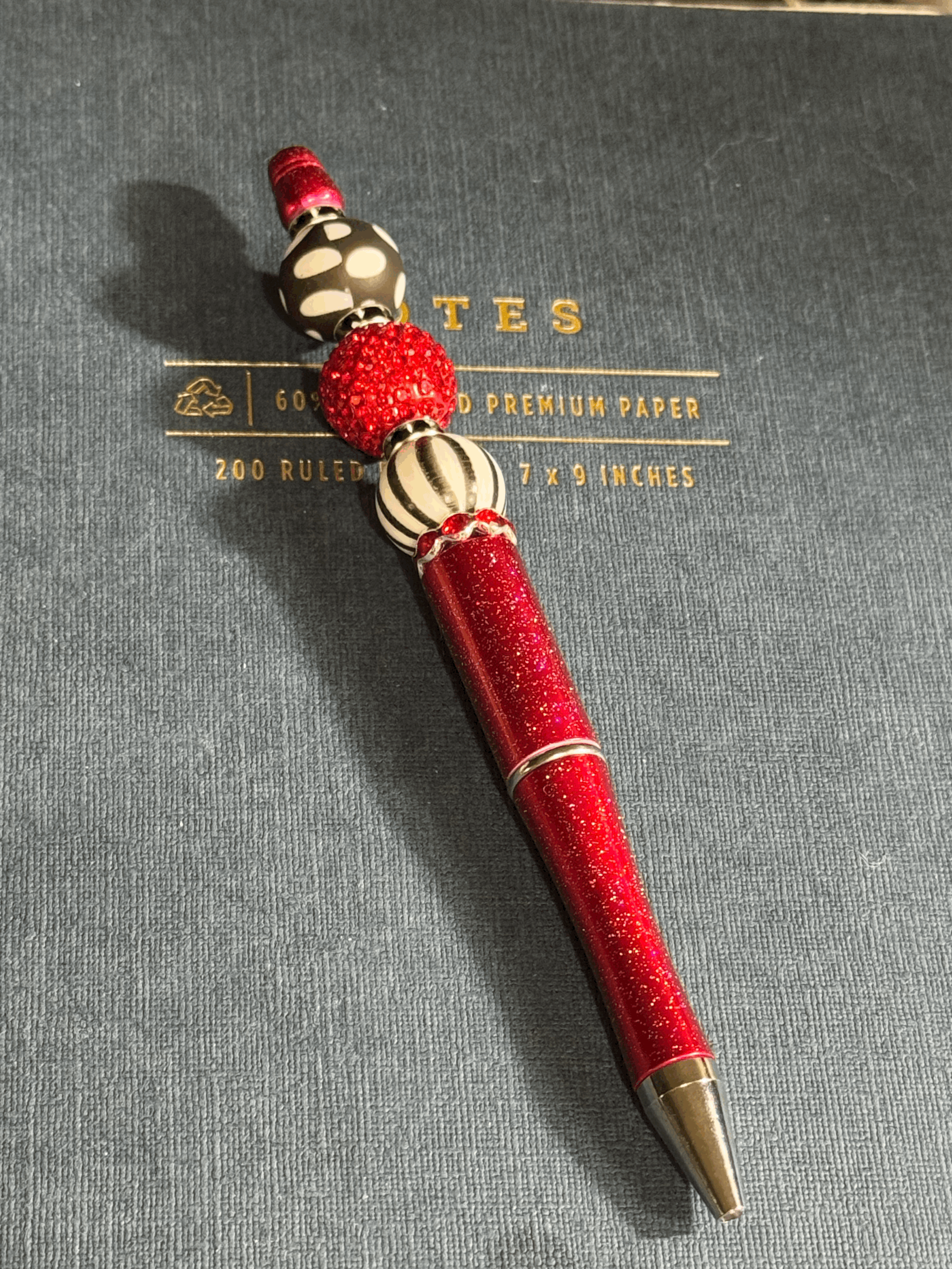 Beaded ink pens